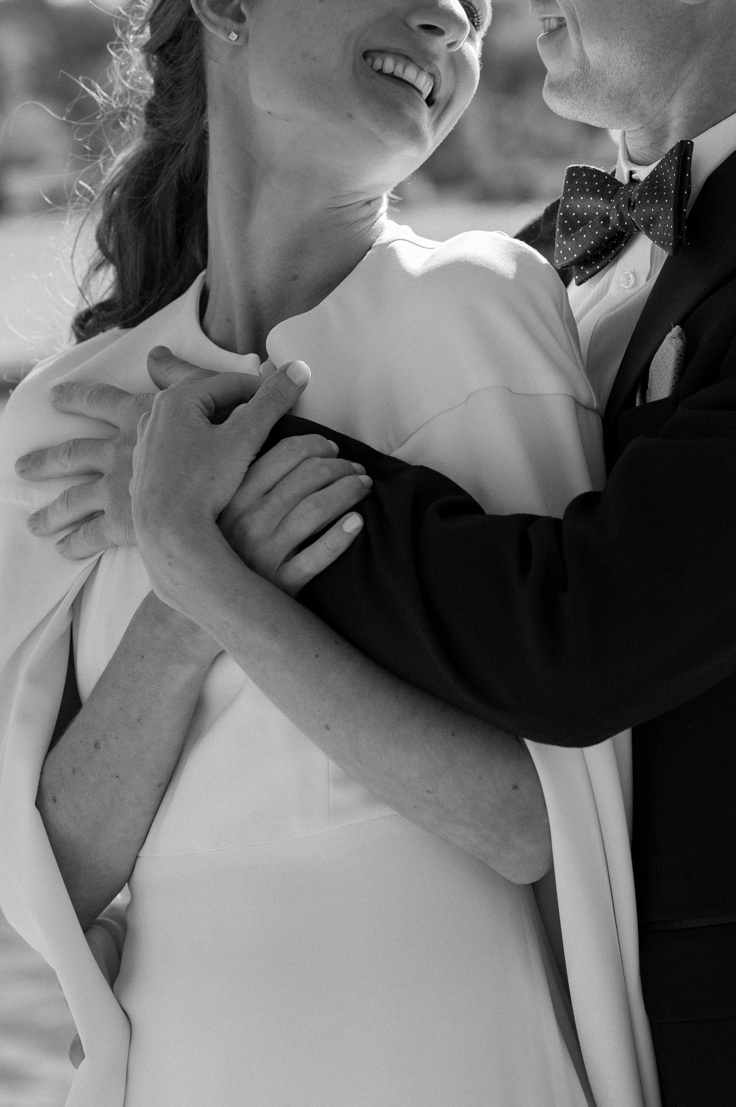 Romantic embrace of a bride and groom during couple's wedding portraits in the Berkshires Massachusetts