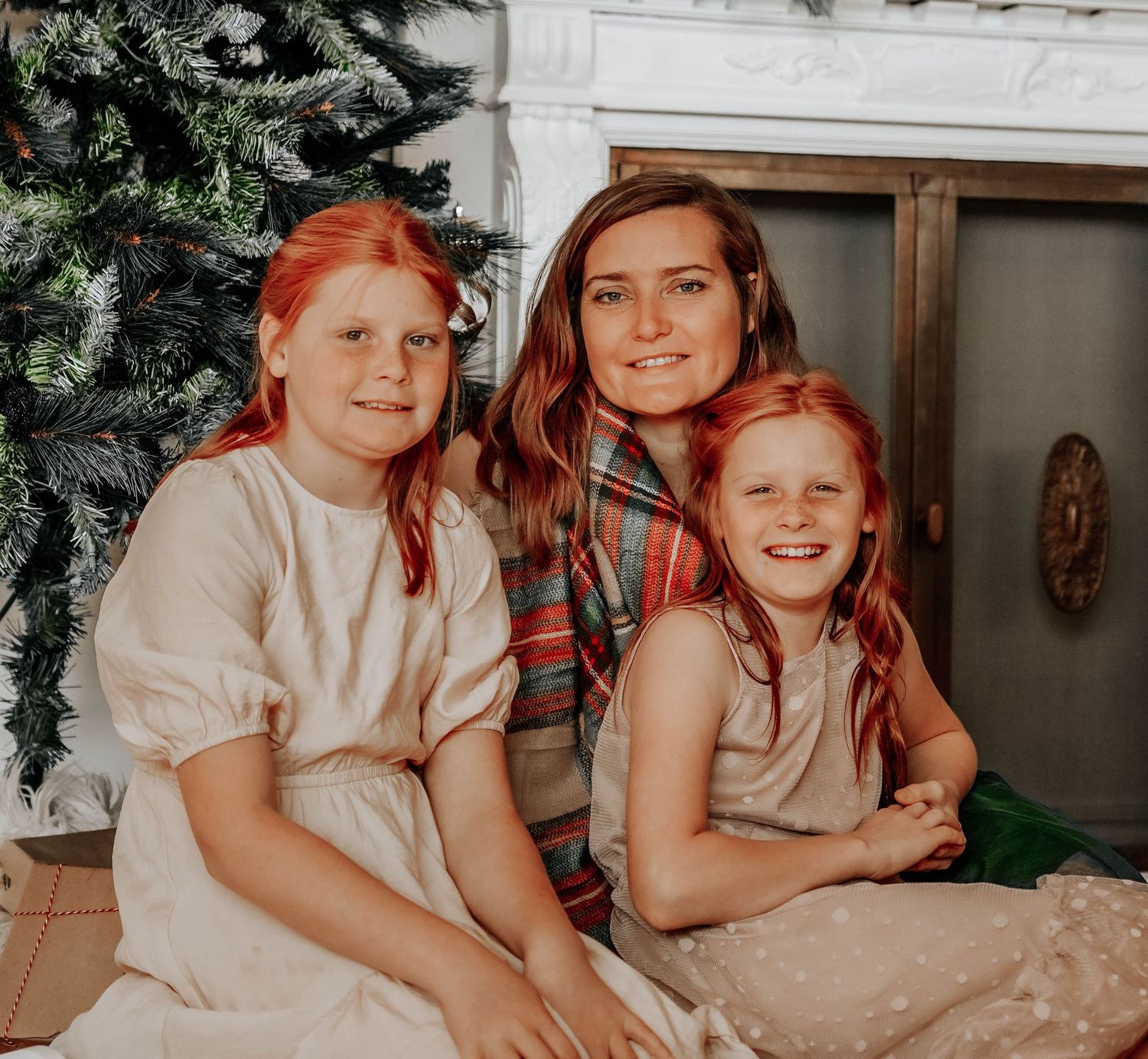 Holiday-themed indoor family photos with warm lighting and festive decorations.