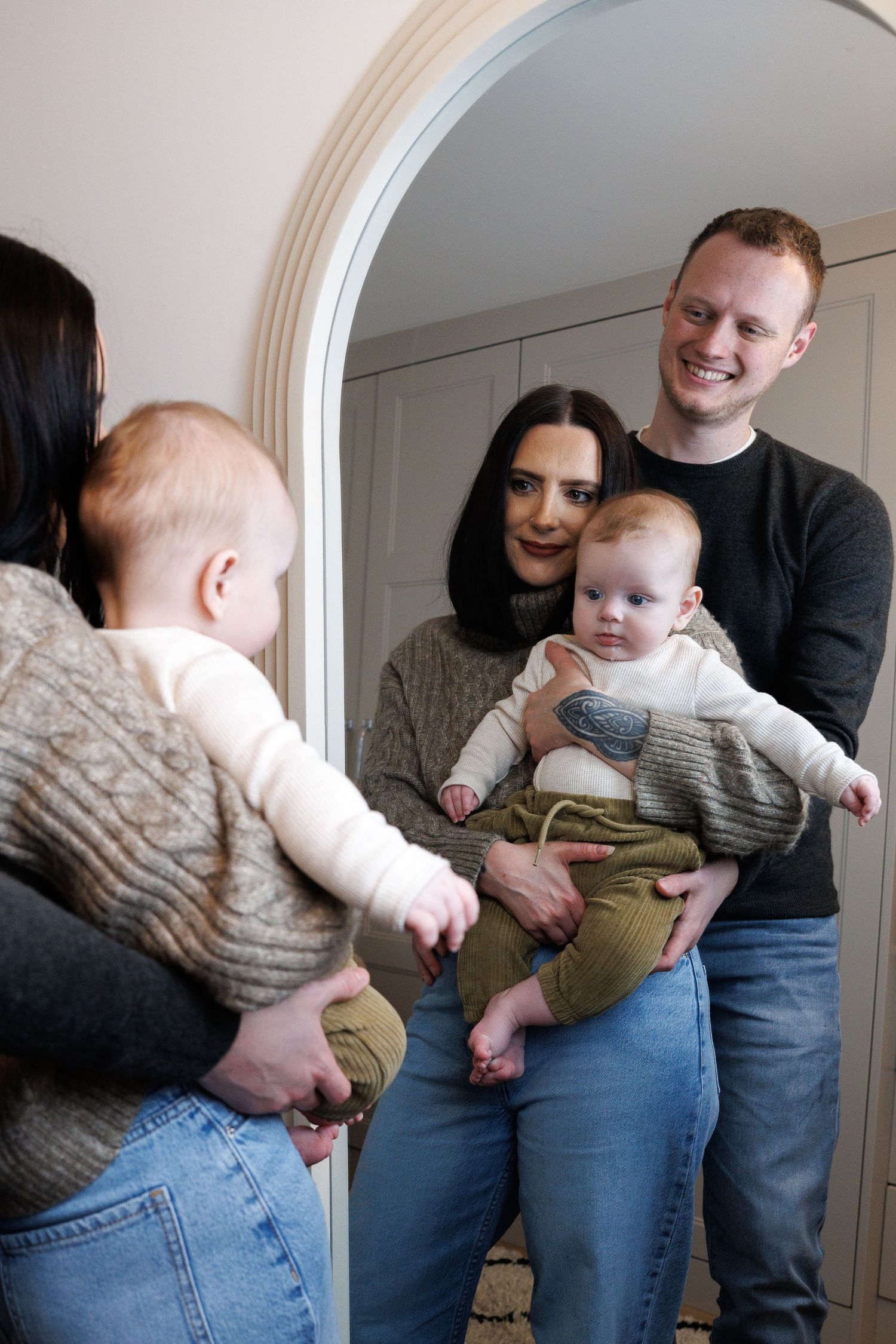 A sequence of photos showing a baby being playfully tipped sideways while being held by adults in a home setting.