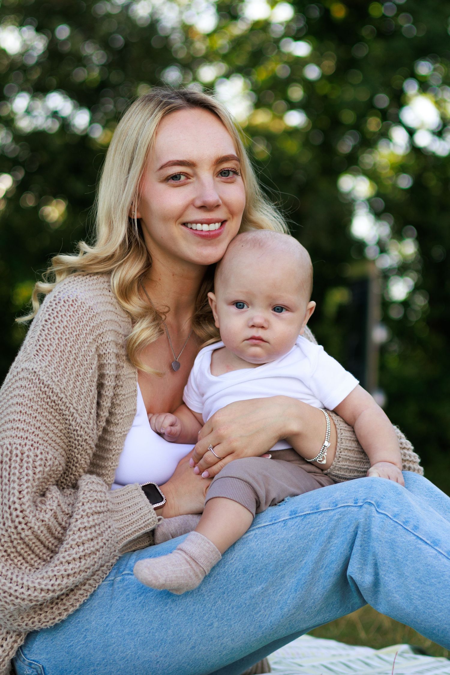 A mother and baby share tender moments outdoors in a series of candid photos showing affection and bonding.