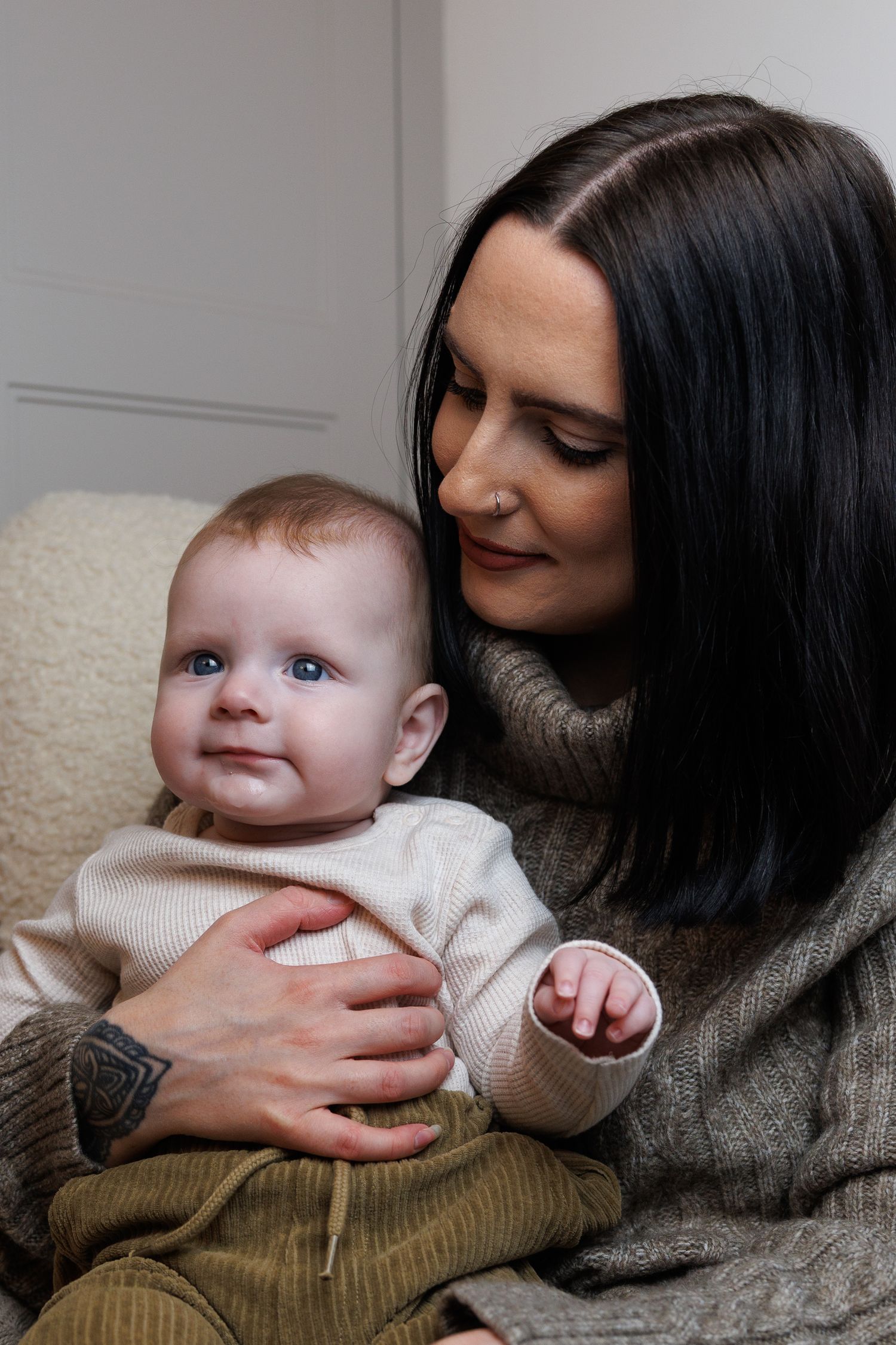 A tender sequence of photos showing a parent and baby sharing sweet moments together on a couch.