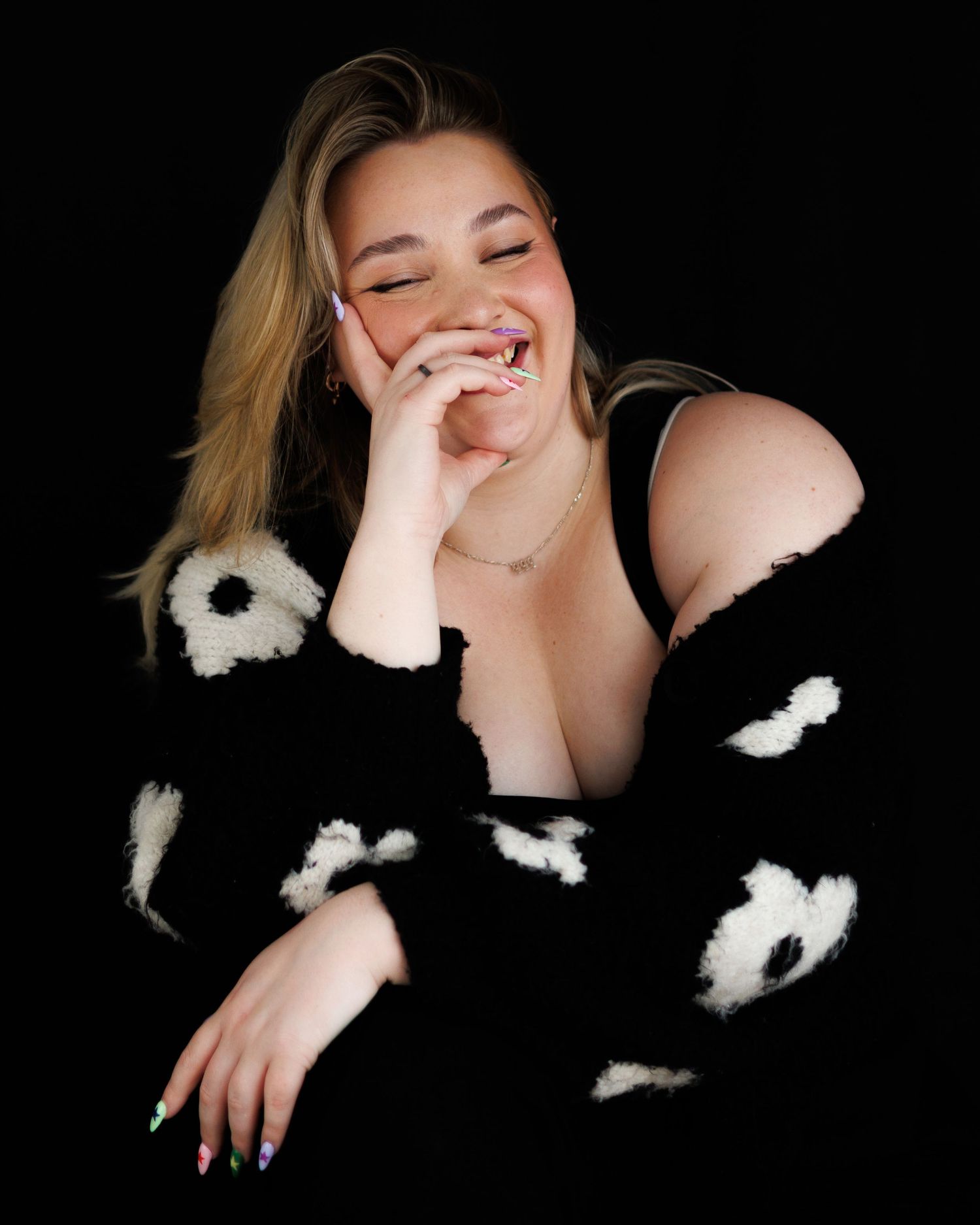 A series of black and white portraits showing joyful expressions and white floral accessories against a dark background.