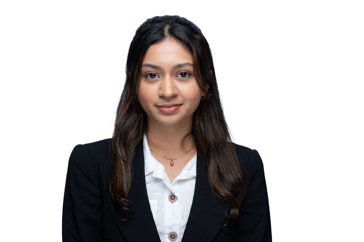 Professional portrait of someone wearing a black blazer and white shirt against a dark backdrop.