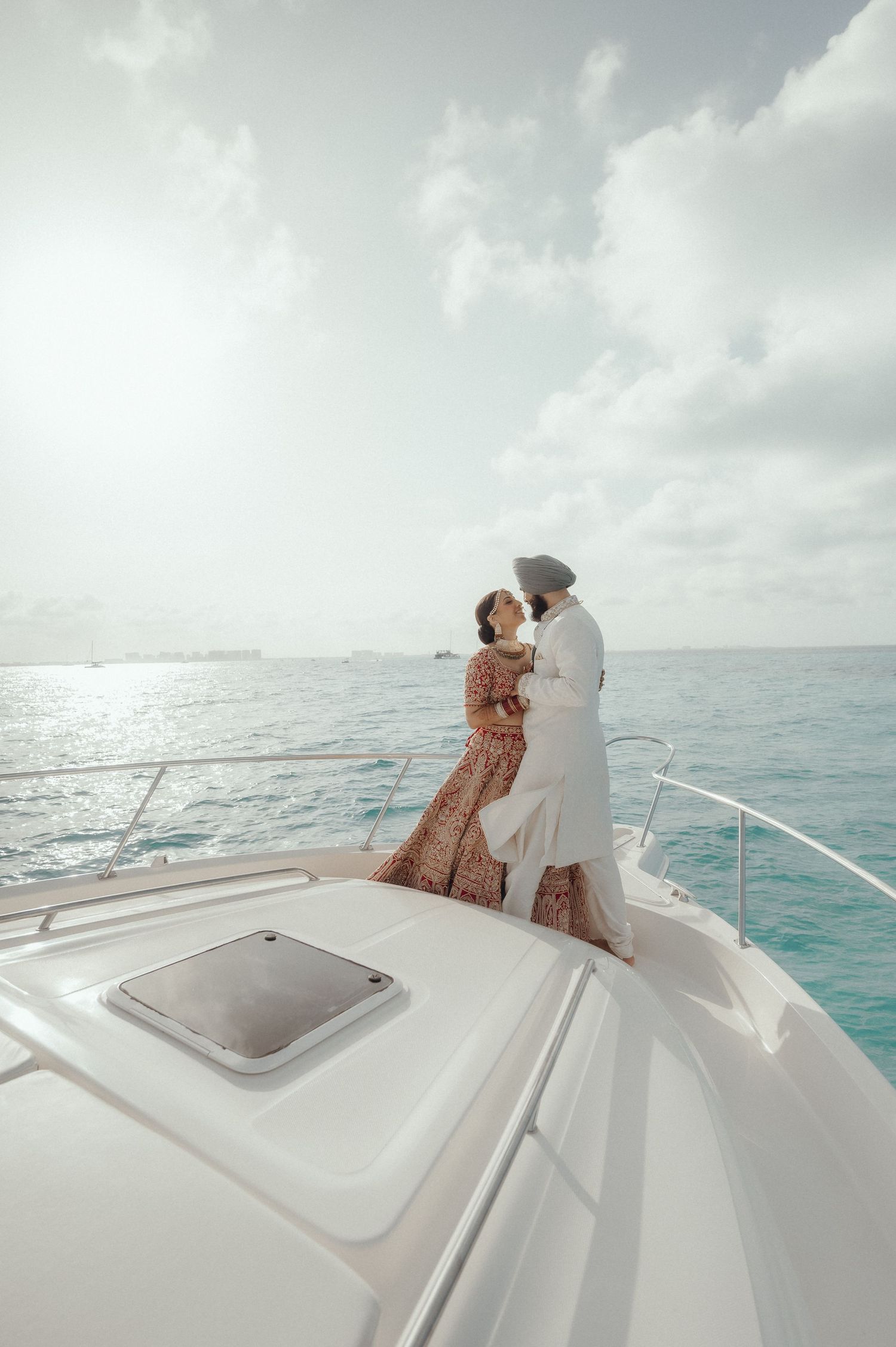 Four sequential photos show a serene white yacht deck against turquoise ocean waters under cloudy skies.