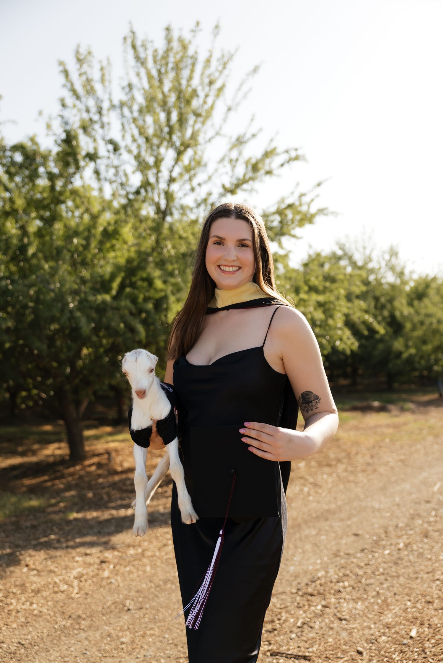 Joyful moments captured in a sunlit orchard setting.