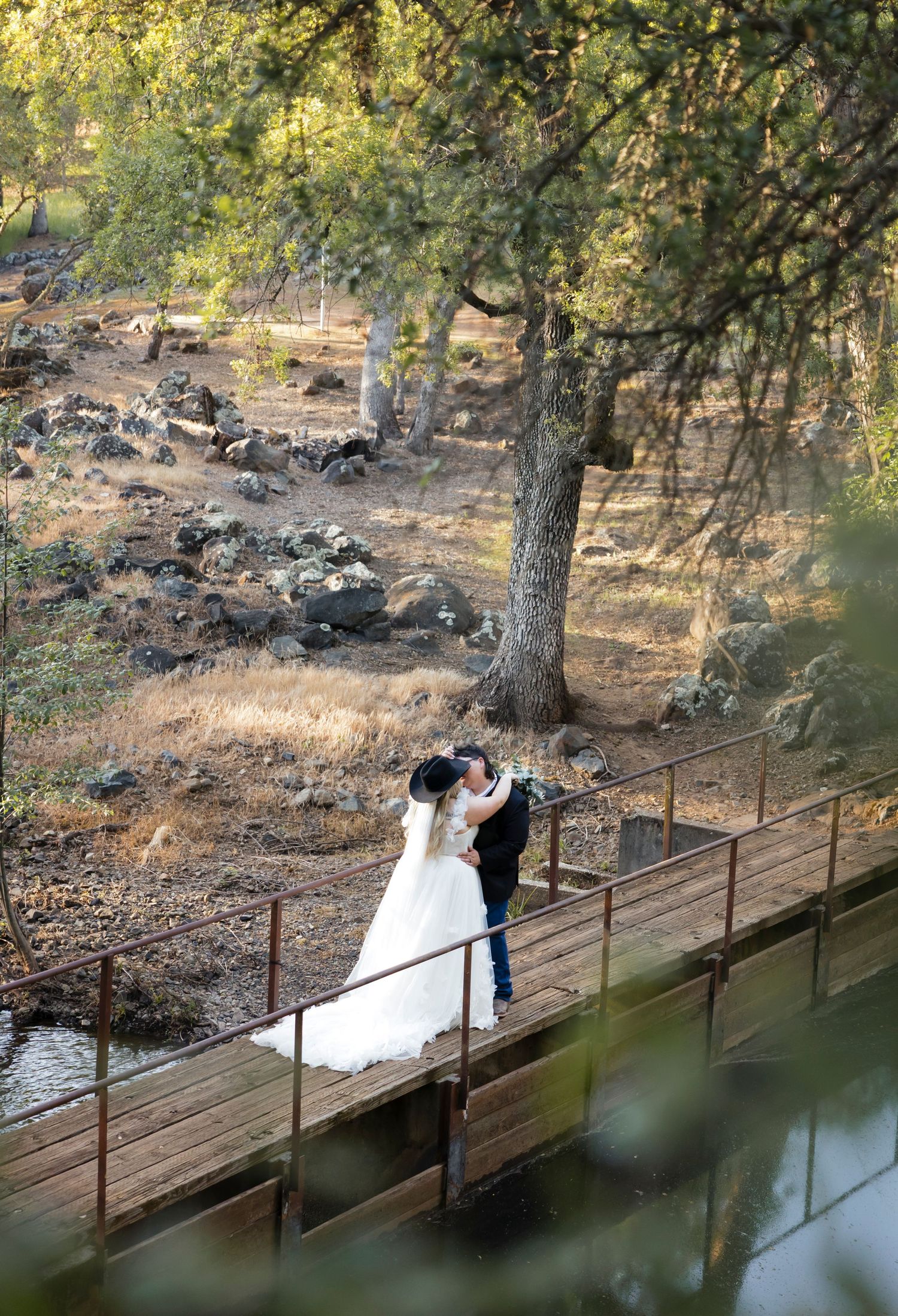 Western wedding photos with cowboy and his wife for rustic sunset photos