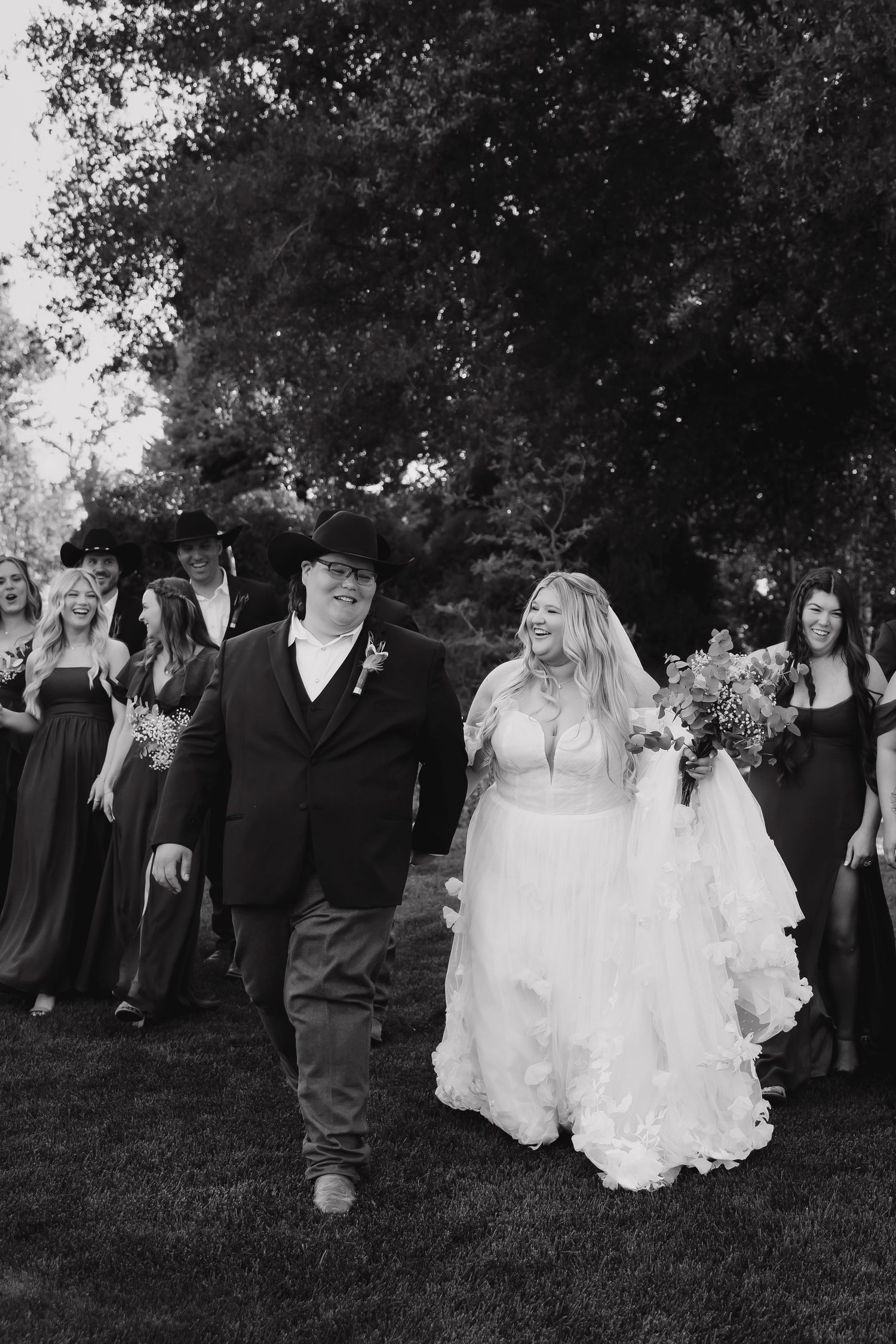 Western wedding party photos with cowboy and his wife