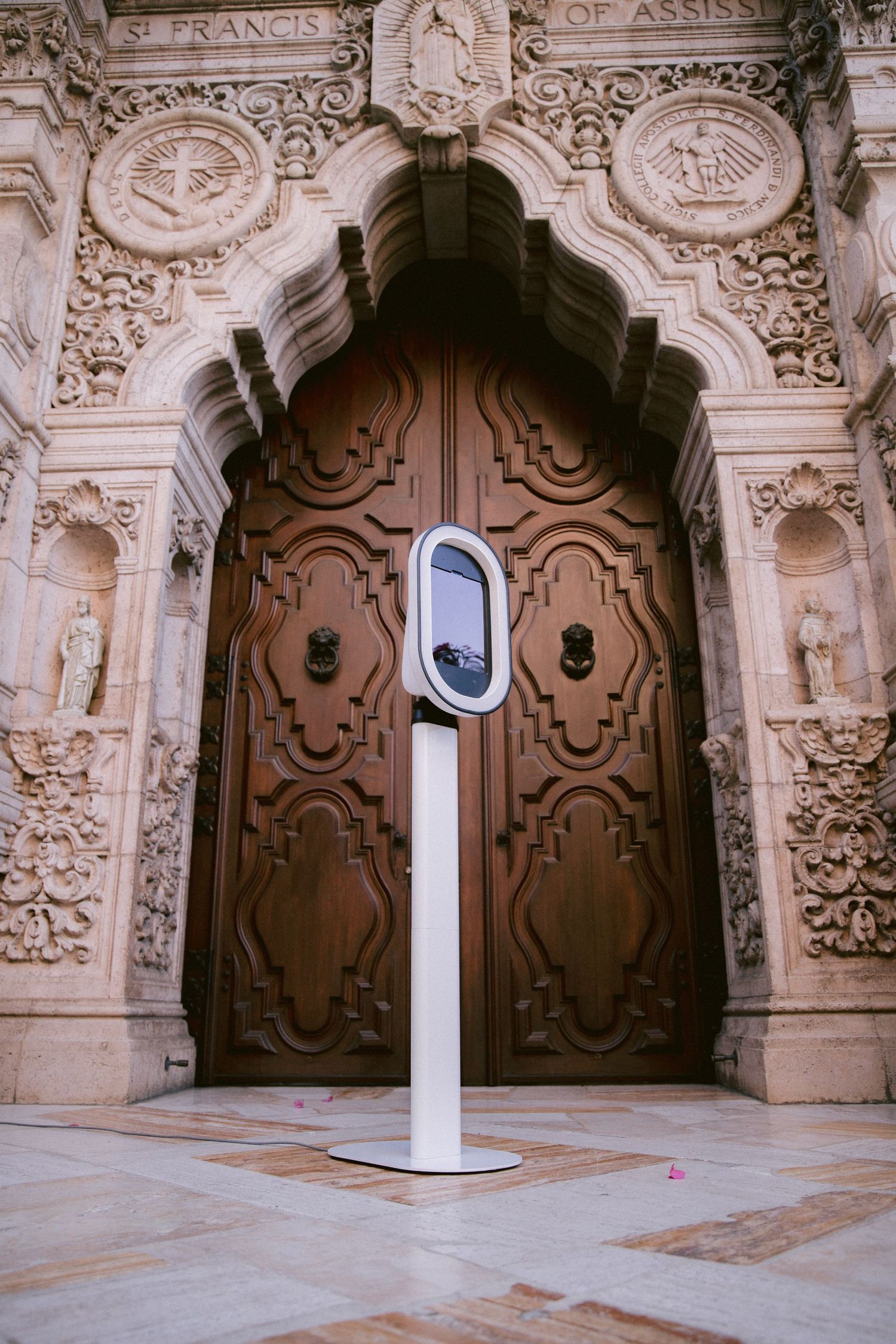 Historic St. Francis church entrance featuring intricately carved stone details and wooden doors.