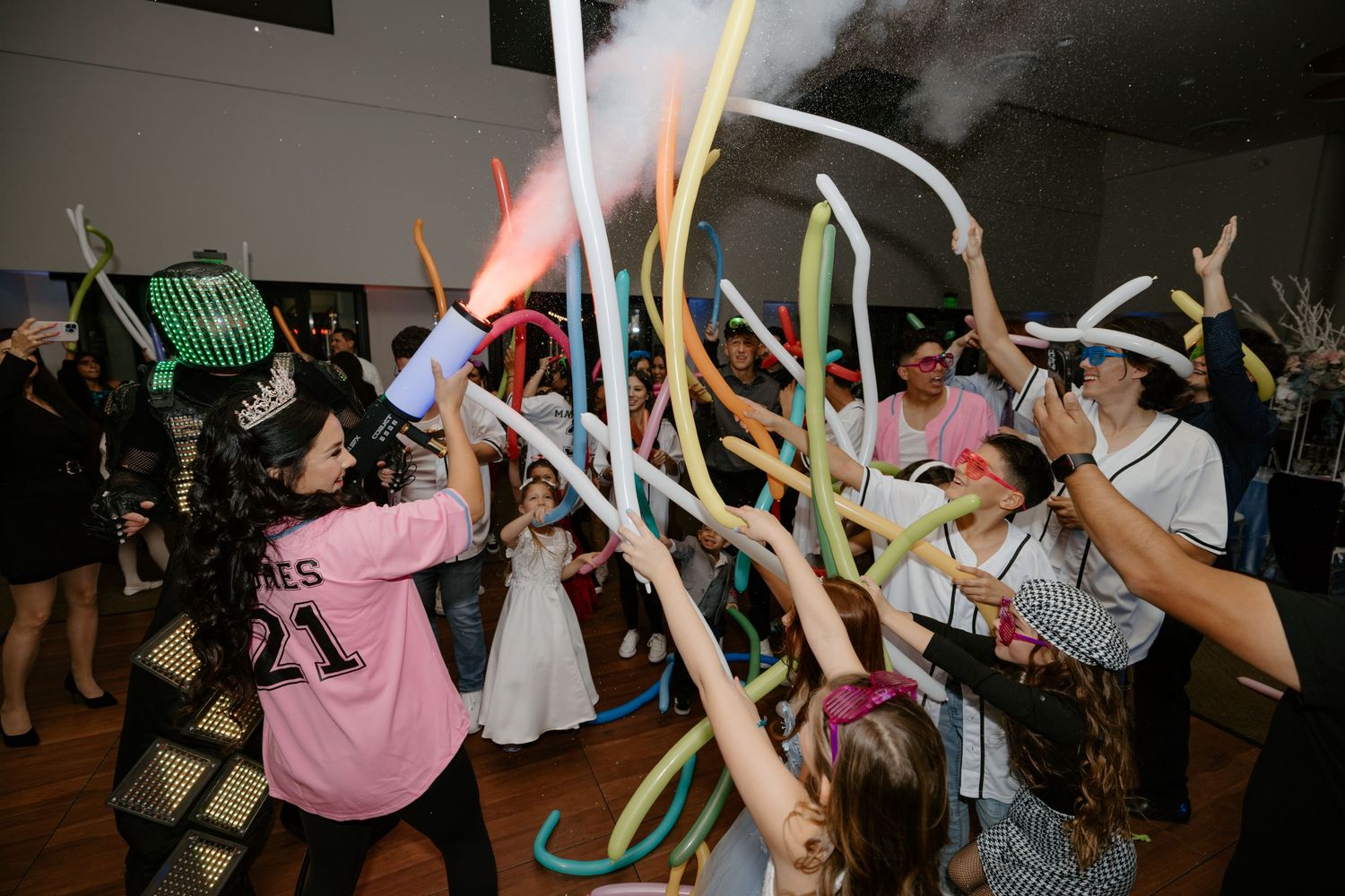 Lively dance party scene with colorful glow sticks and celebration lights.