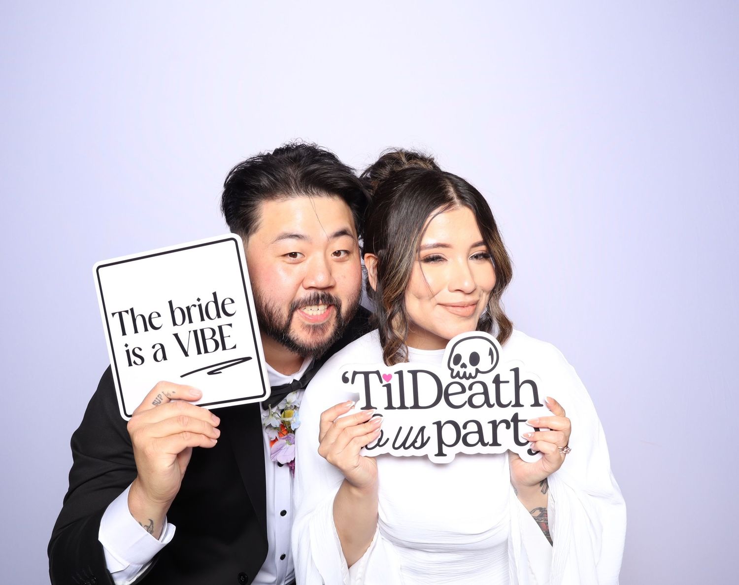 A series of photo booth style images showing people holding up signs with wedding vows and phrases.