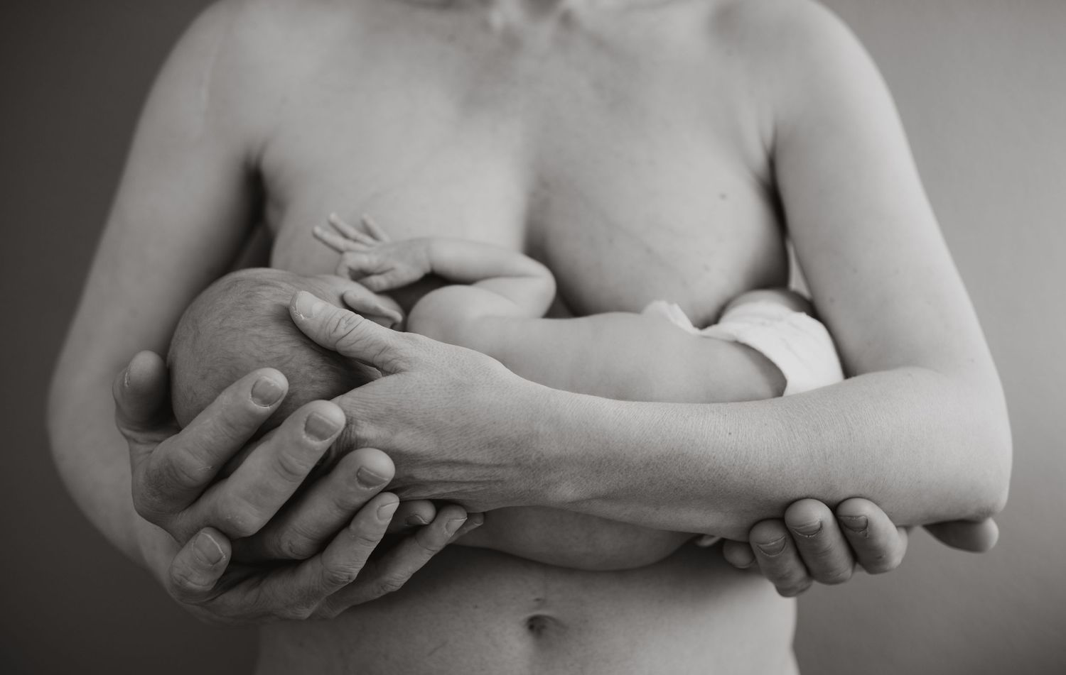 A mother holding a baby in their arms, black and white, Erfurt