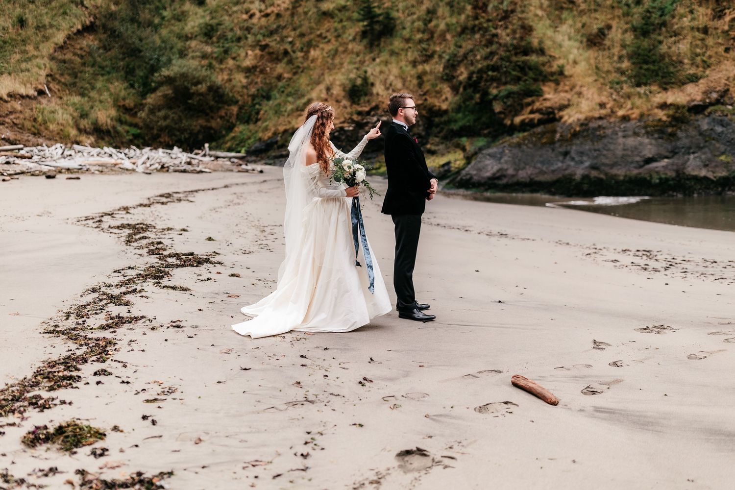 Bride and groom share a moment during their beach elopement ceremony.