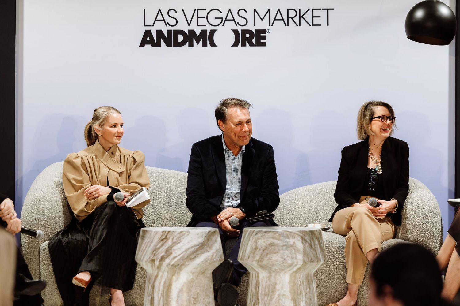 Three panelists sit on a sofa at a Las Vegas Market AndMore event.