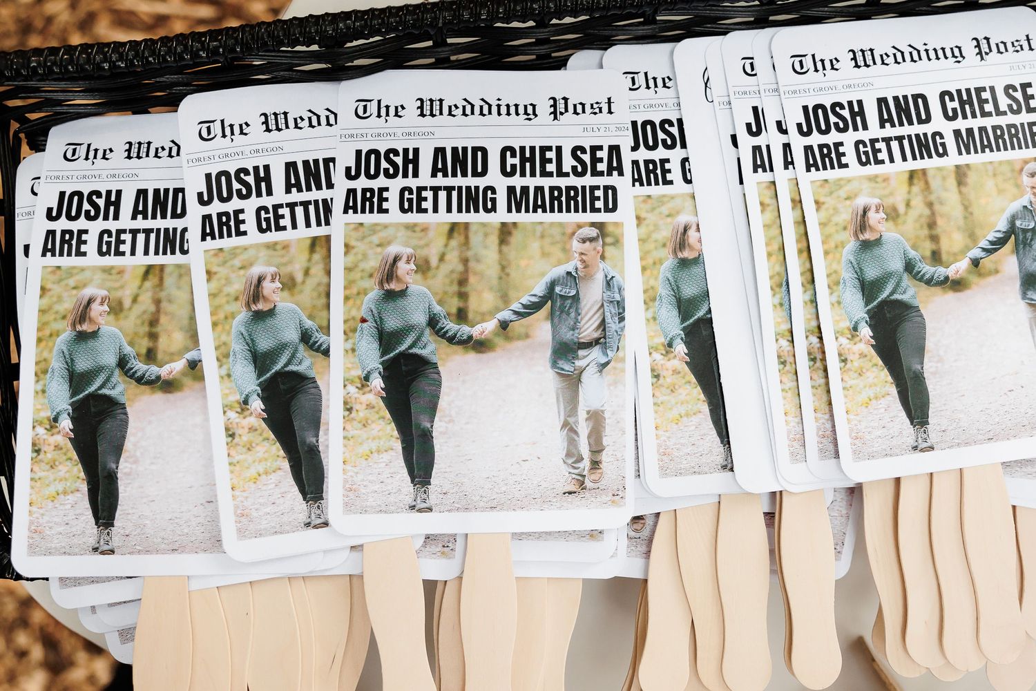 Wedding program fans designed as newspaper front pages announcing Josh and Chelsea are getting married.