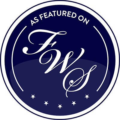 Navy blue circular badge with elegant FWS script and stars.