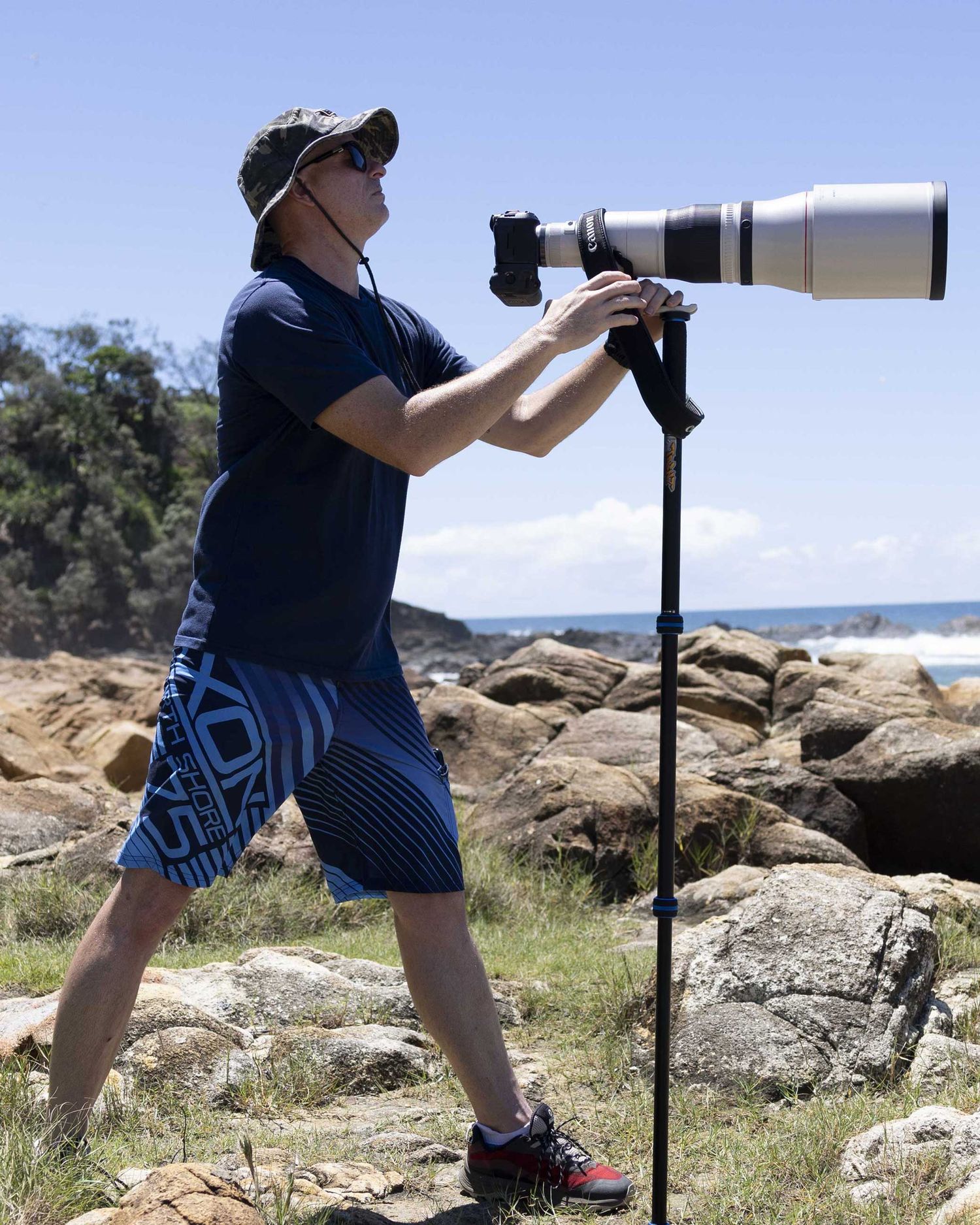Nick Wigmore Photographer with Canon R5 and 600mm RF lens at beach