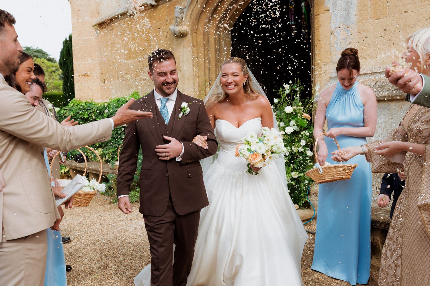 A series of wedding celebration photos showing joyful moments with confetti and dancing in an outdoor garden setting.