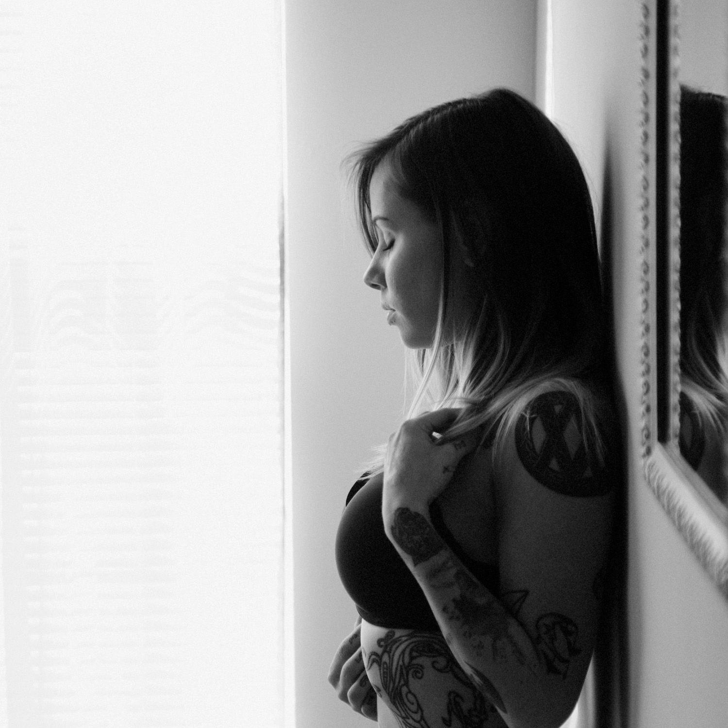 Black and white photo series showing a person drinking from a cup in different poses against a light background.