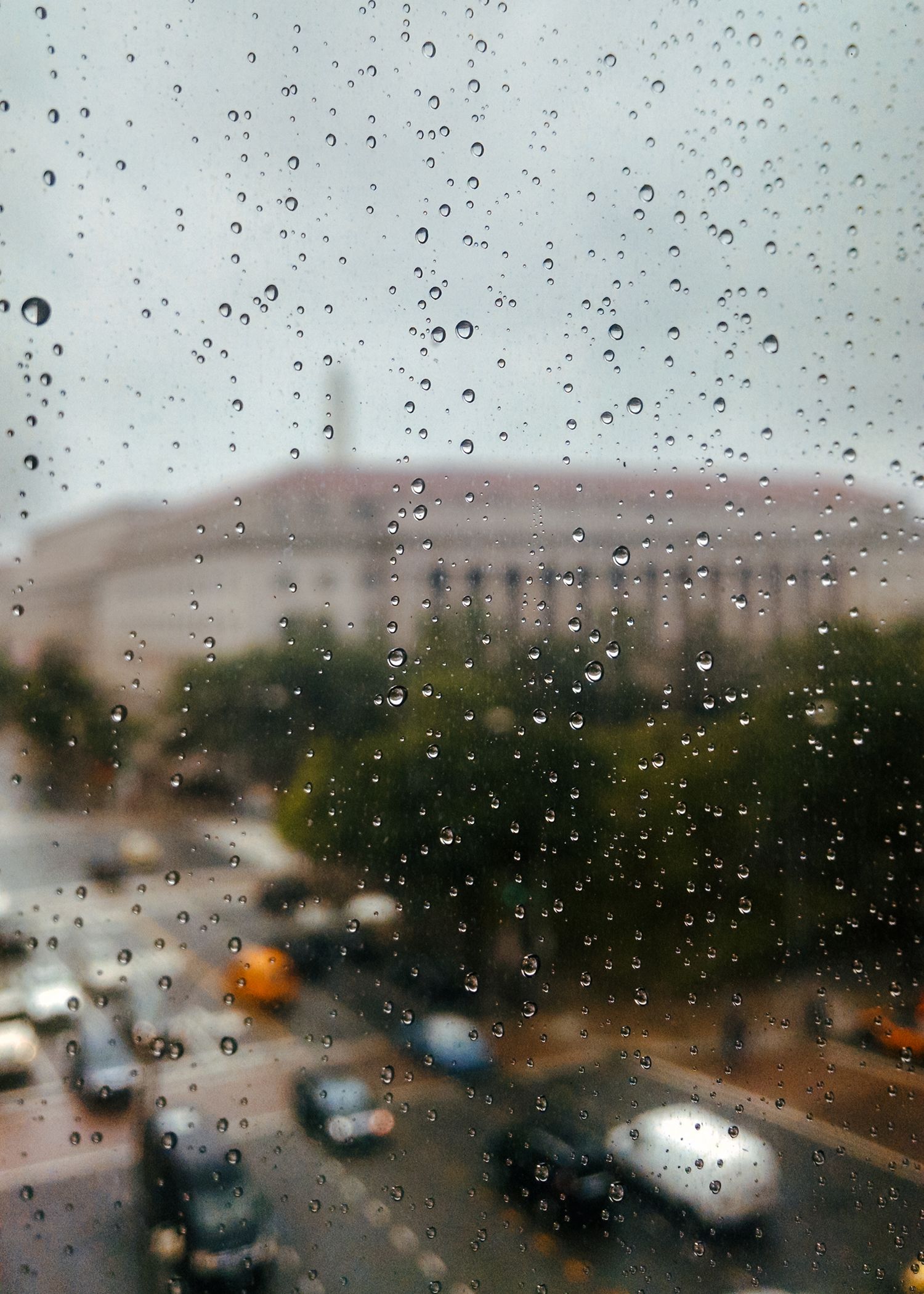 Rush hour in Washington DC, viewed through a rain streak window.
