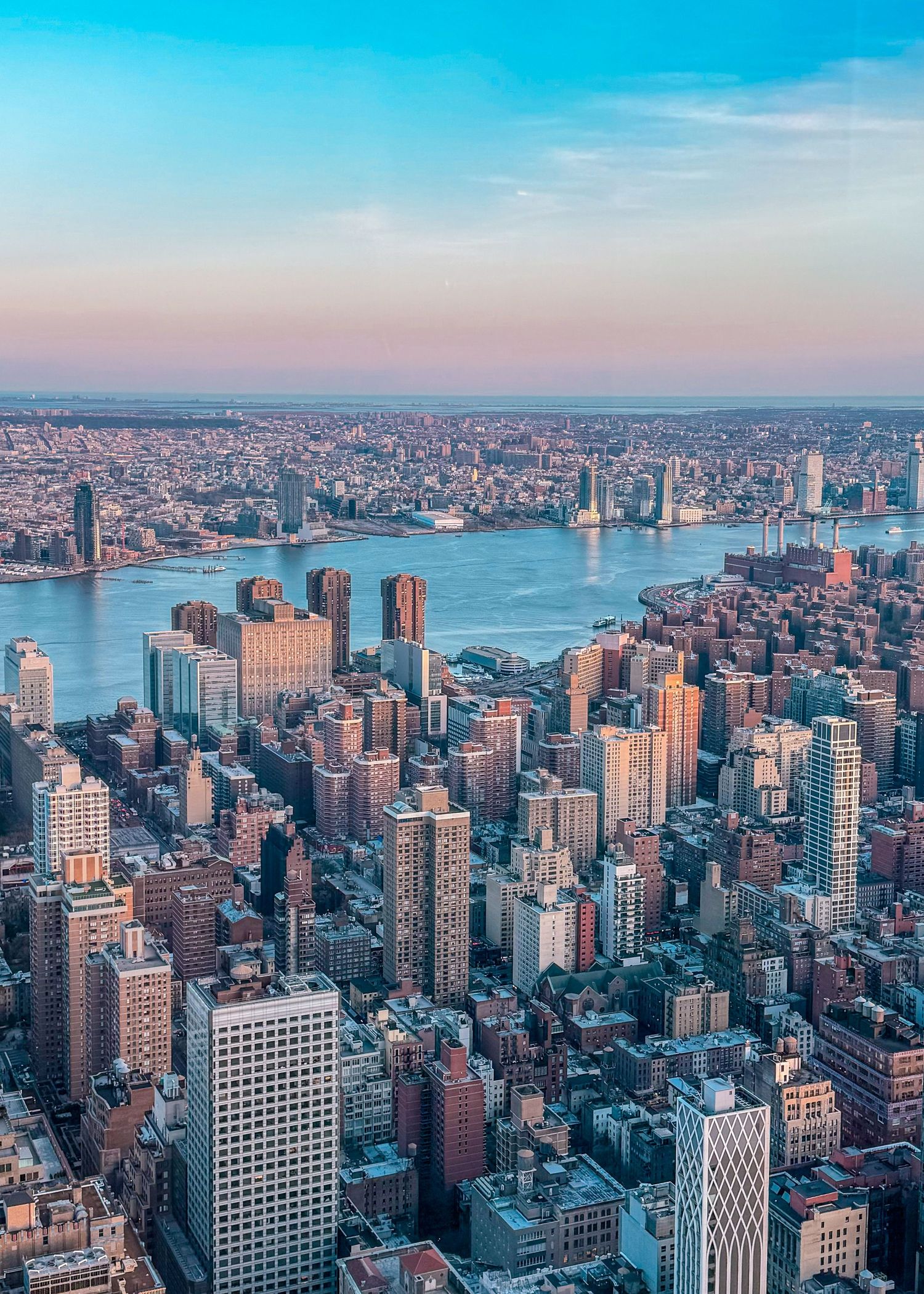 A skyline view of New York City at sunset.