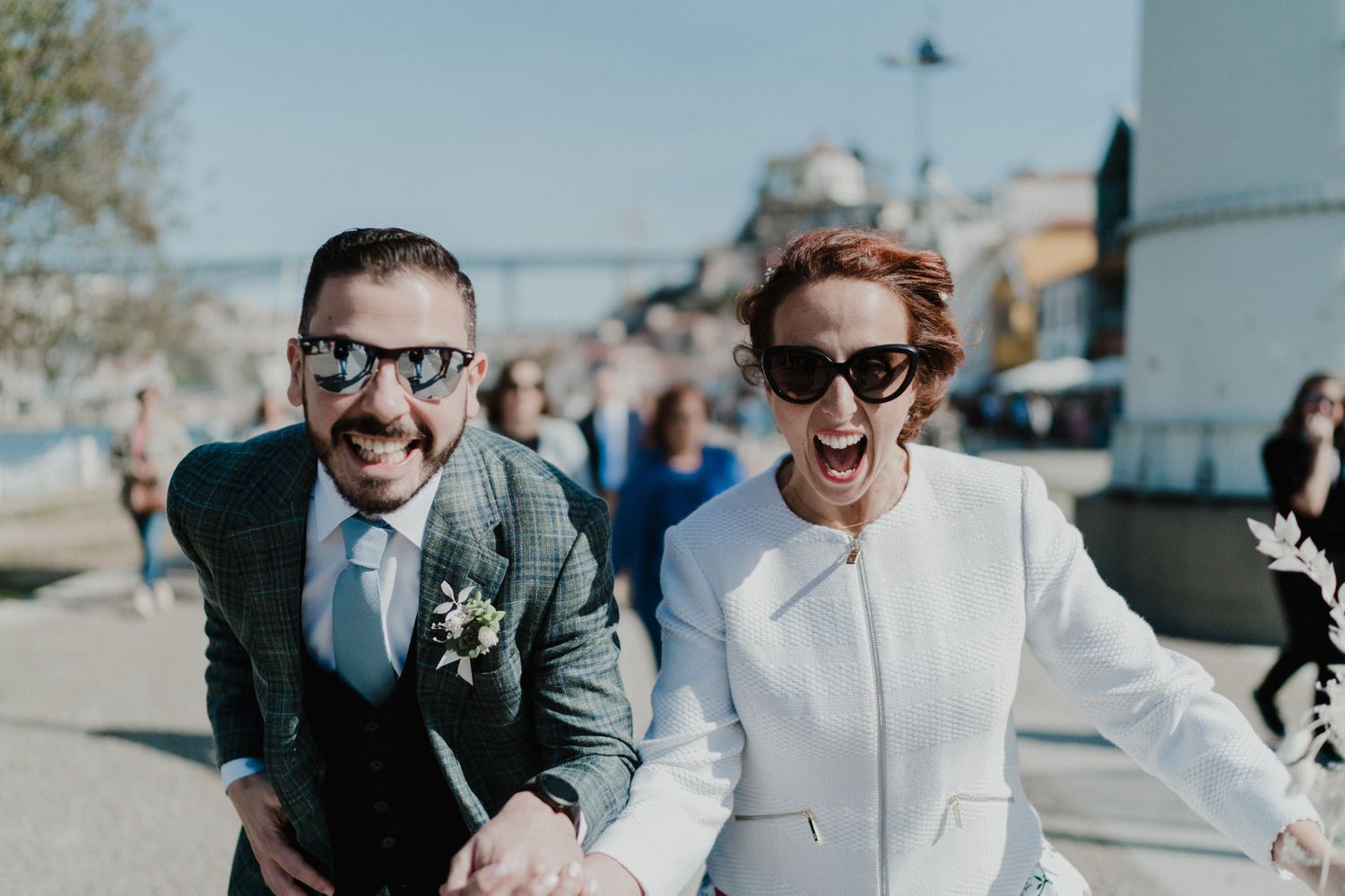 Newlyweds walking through Porto city streets together