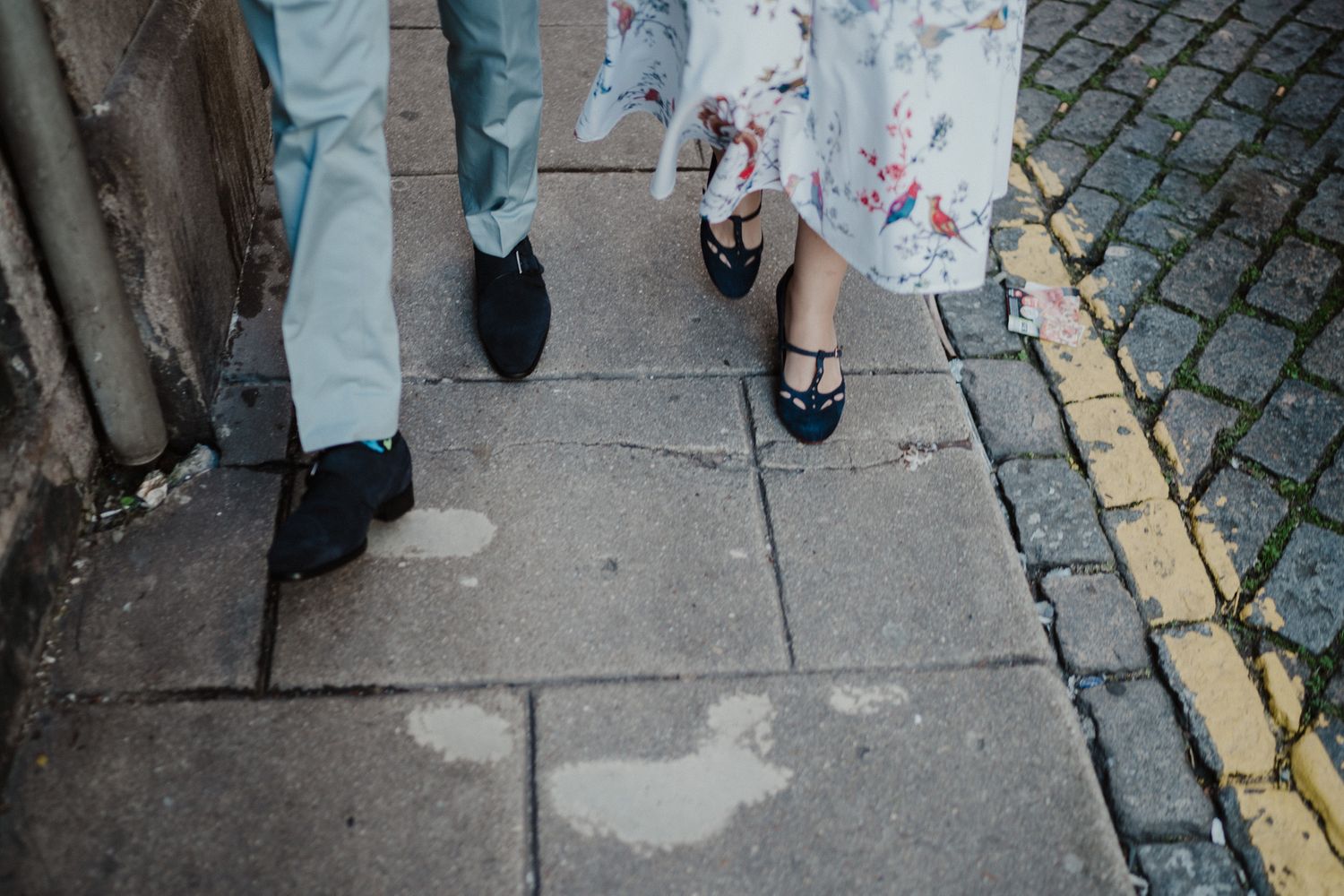 Bride and groom walking through Porto streets after their wedding