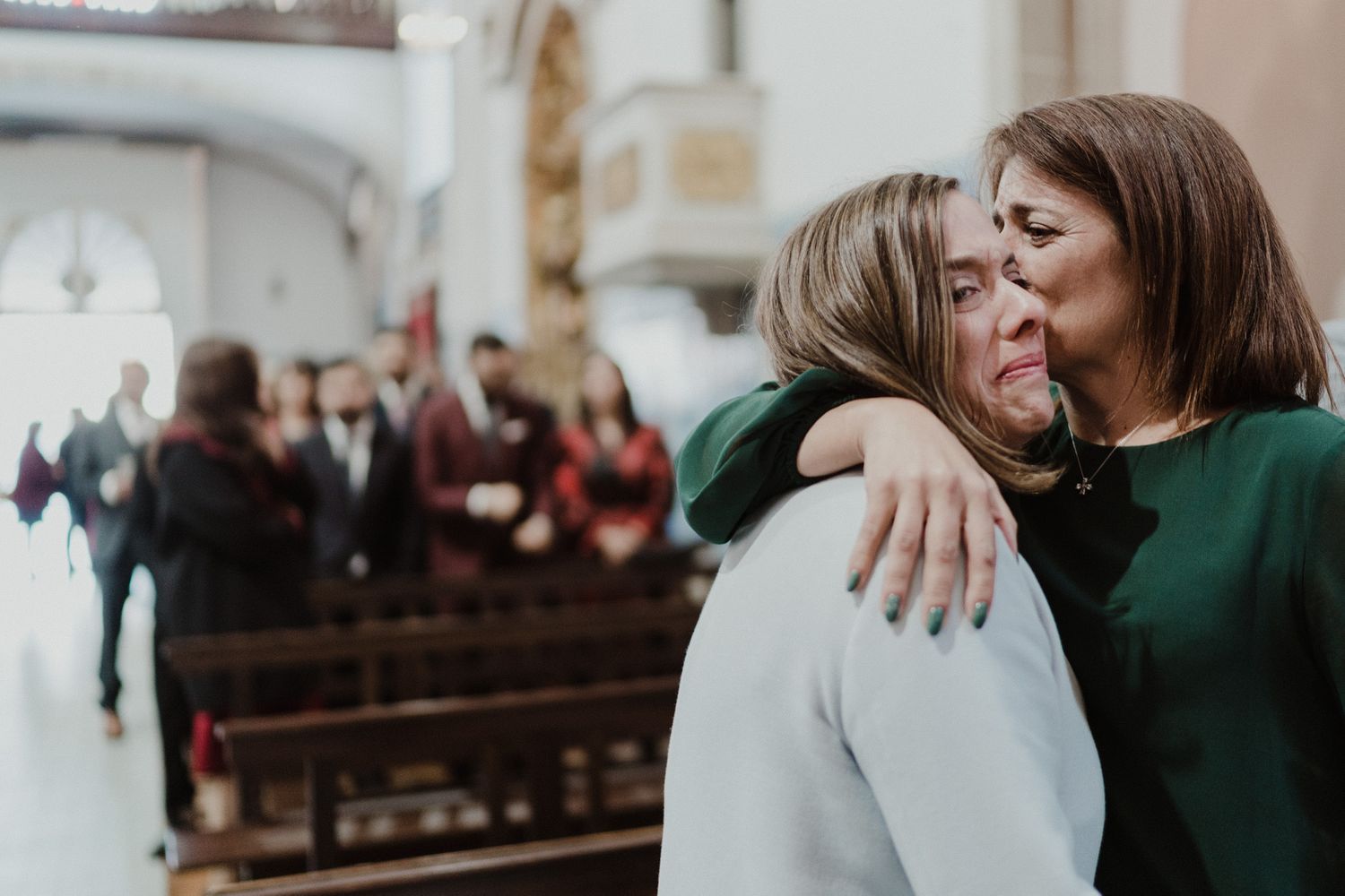 Emotional embrace between guests during an intimate wedding in Porto