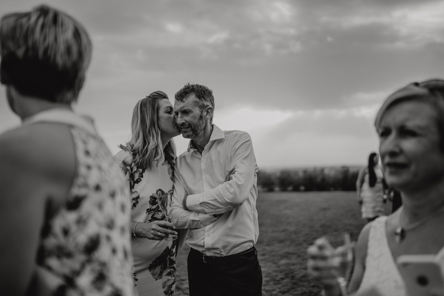 Algarve wedding photographer capturing an emotional cake cutting scene at beachside venue