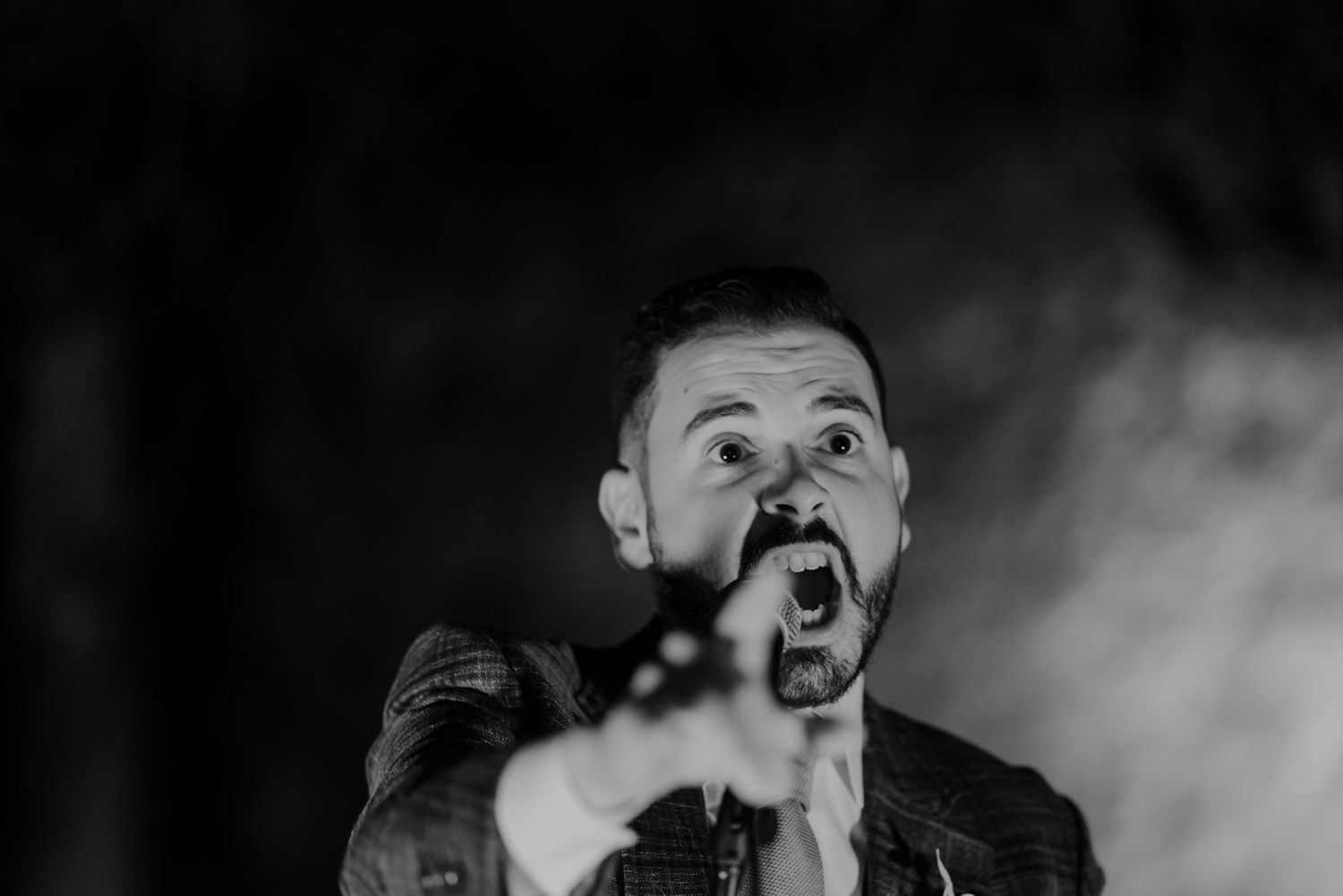 Groom singing during an intimate celebration in Porto