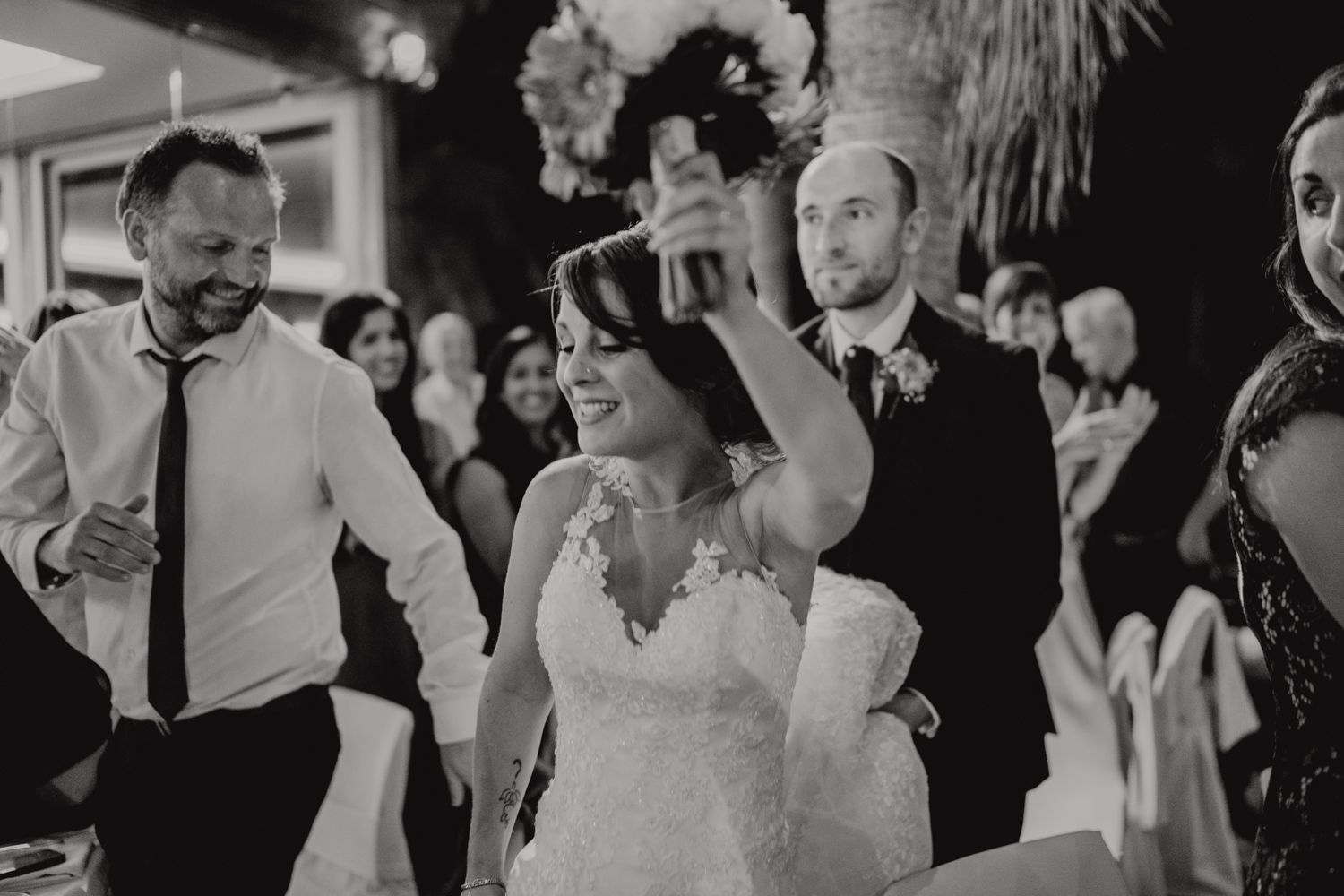 Algarve wedding photographer capturing candid moments at sunset reception in Portugal