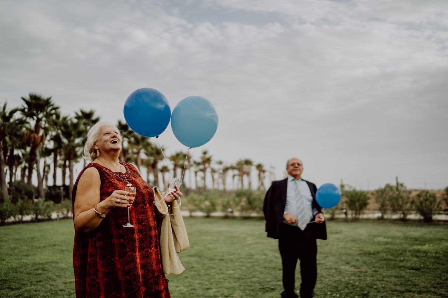 Algarve wedding photographer capturing an emotional cake cutting scene at beachside venue