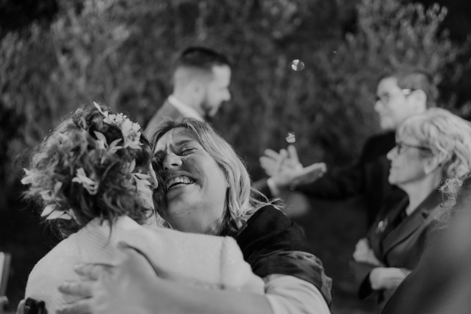 Guests embracing during a joyful wedding moment in Porto