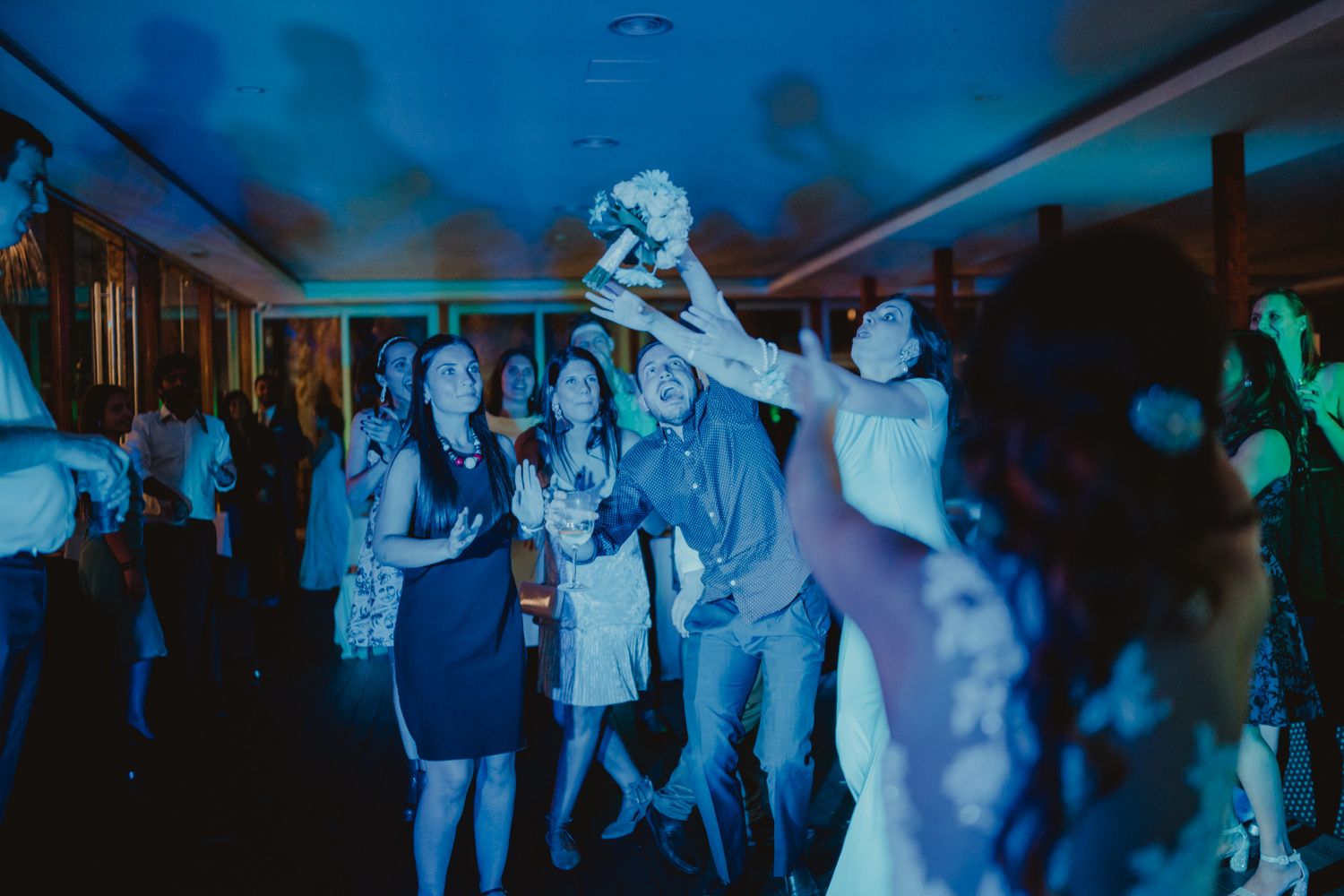 Algarve wedding photographer capturing the energy of the bouquet toss