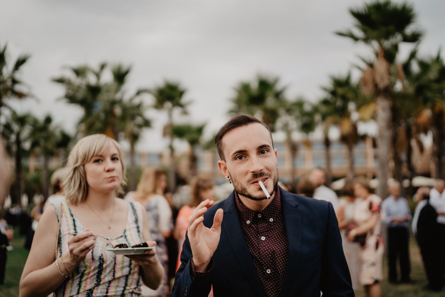 Algarve wedding photographer capturing an emotional cake cutting scene at beachside venue