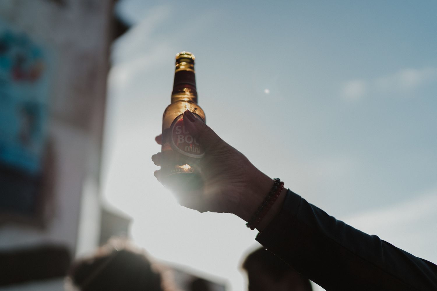 Wedding guests celebrating with a superbock toast during an intimate Porto wedding
