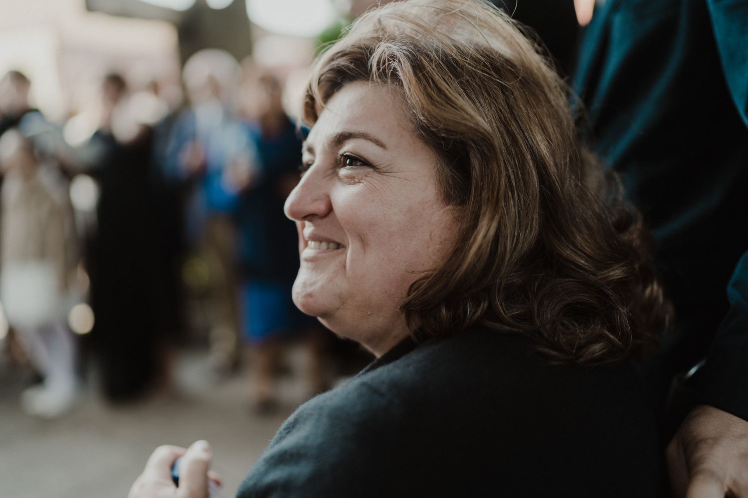 Guest smiling during an intimate wedding celebration in Porto