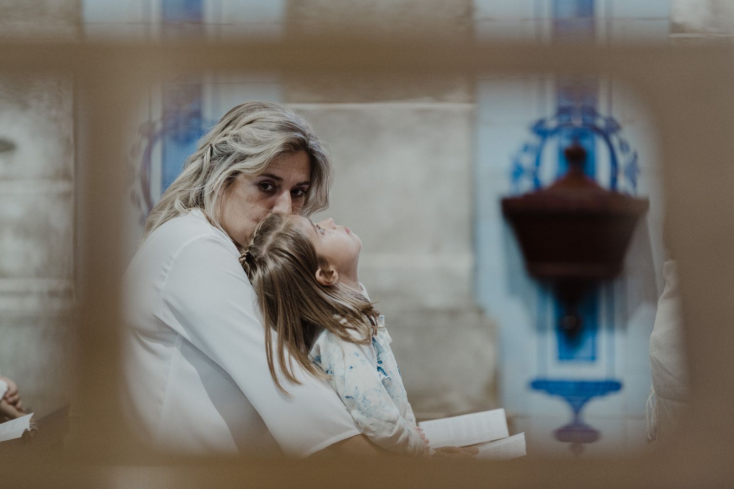 Child resting in arms during a relaxed wedding day in Porto