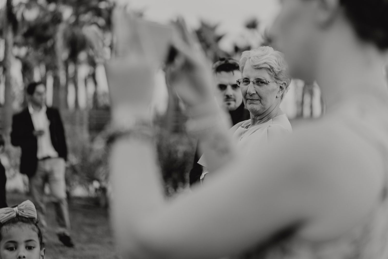 Algarve wedding photographer capturing an emotional cake cutting scene at beachside venue
