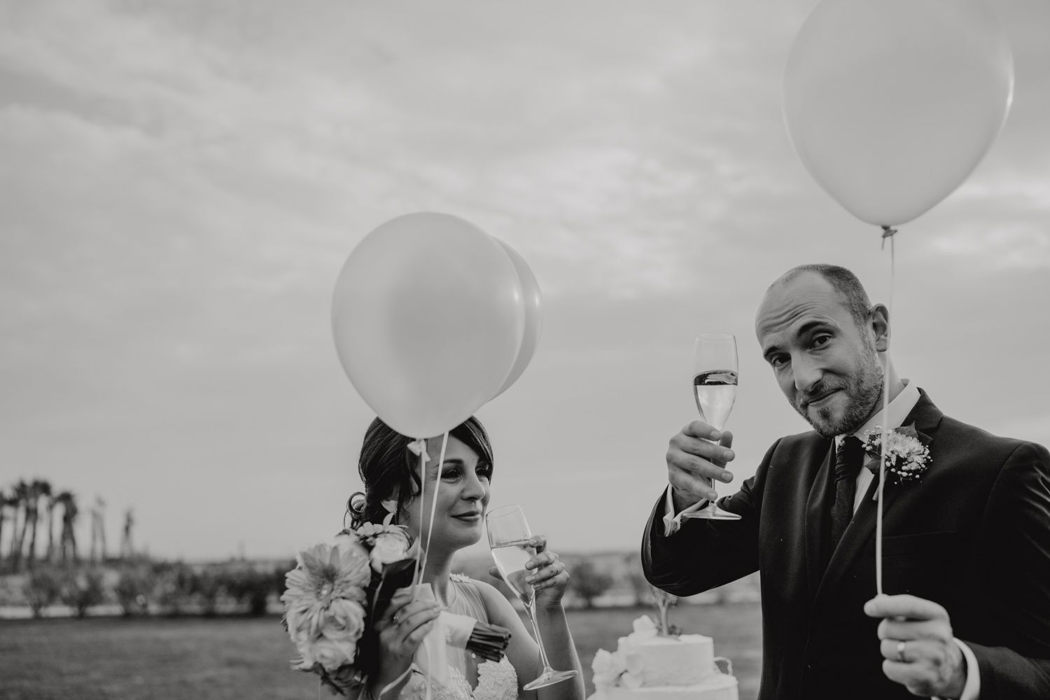 Algarve wedding photographer capturing an emotional cake cutting scene at beachside venue
