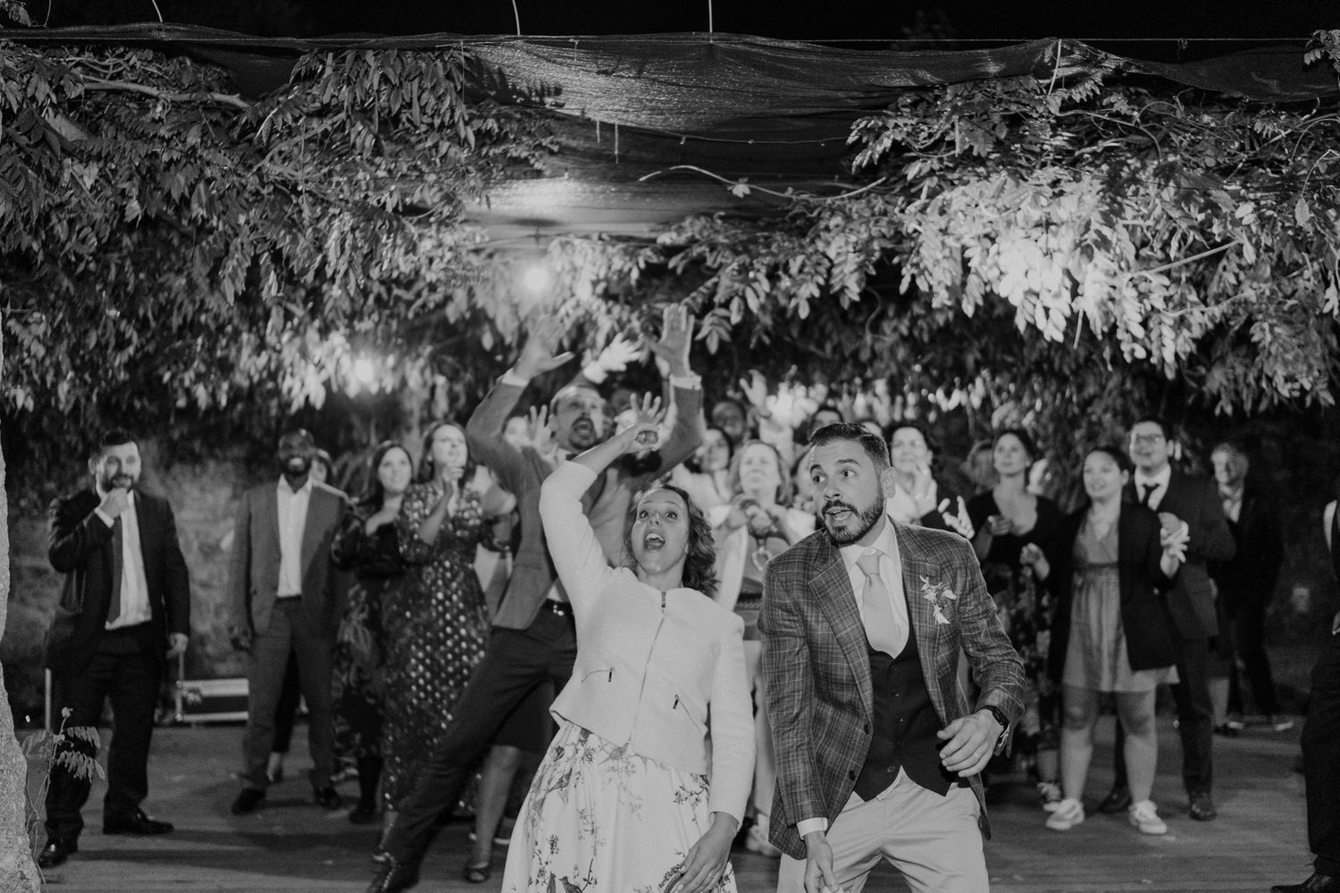 Bouquet toss during a joyful intimate wedding celebration in Porto