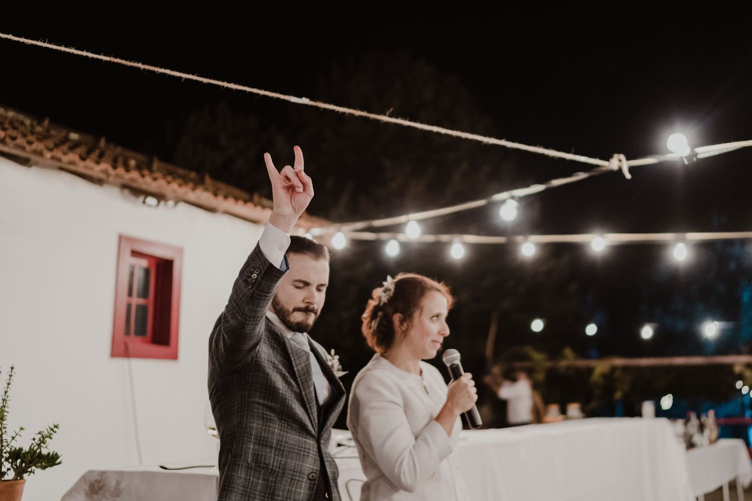 Wedding party under string lights during an intimate Porto celebration