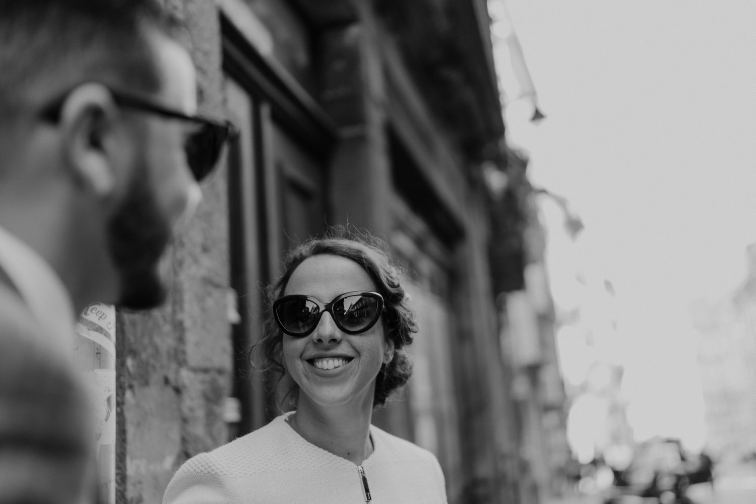 Guest smiling on the streets of Porto during a wedding day