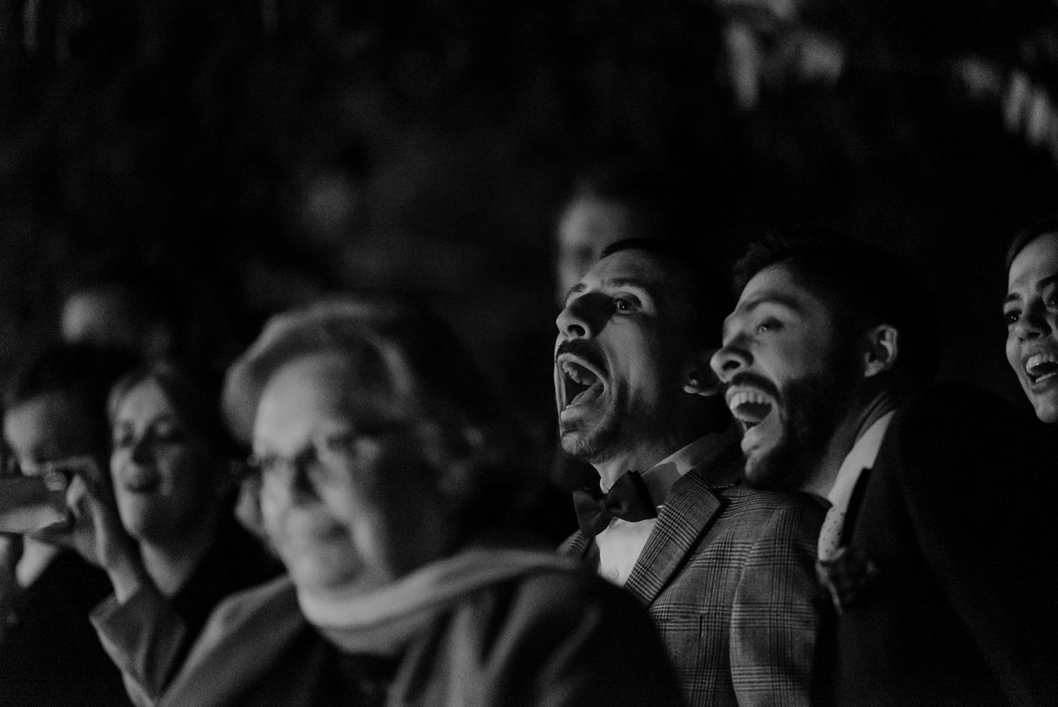 Wedding guests laughing together during an intimate celebration in Porto