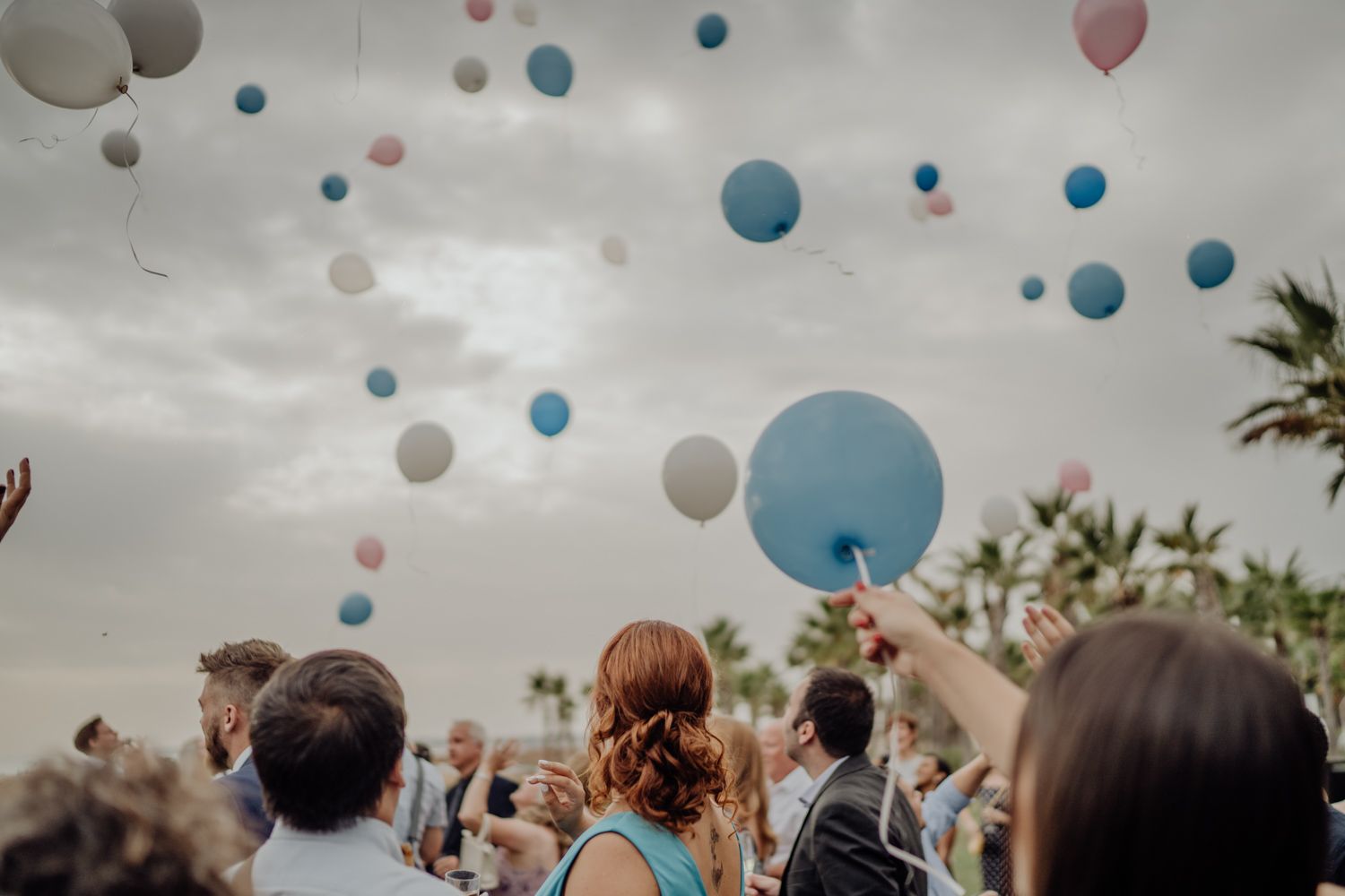 Algarve wedding photographer capturing an emotional cake cutting scene at beachside venue