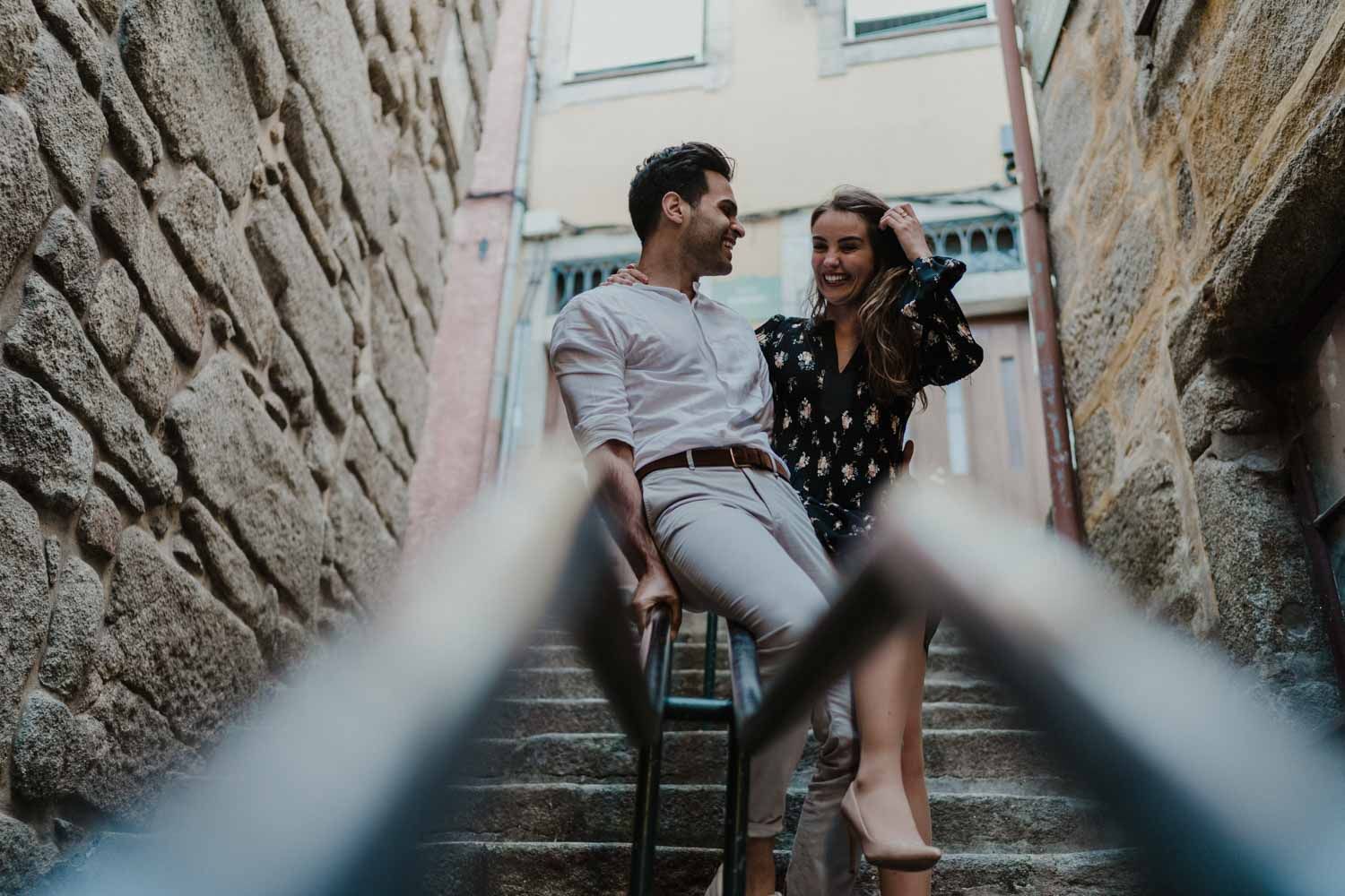 Couple shoot in Porto’s Ribeira with moody light and cinematic vibe