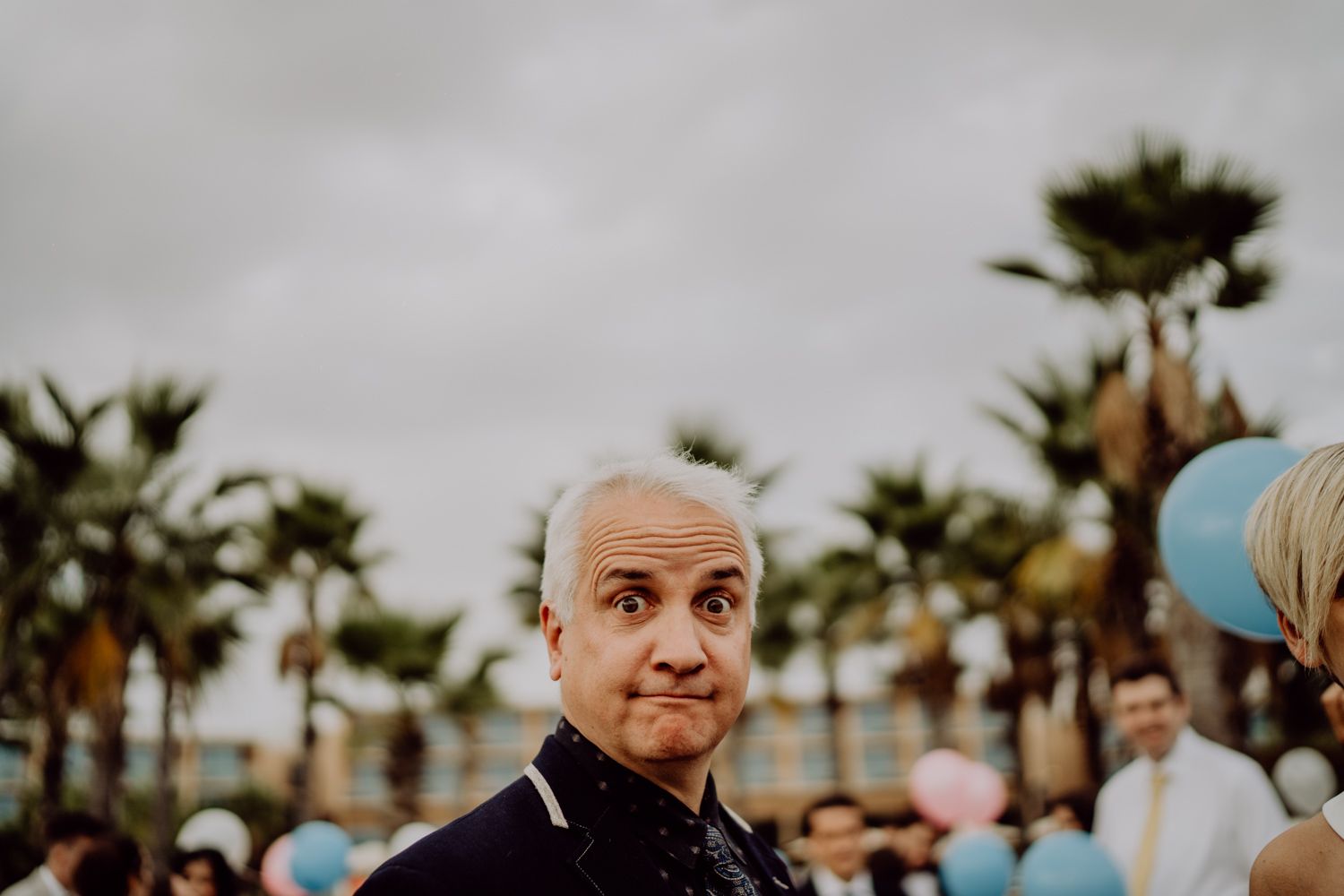 Algarve wedding photographer capturing an emotional cake cutting scene at beachside venue