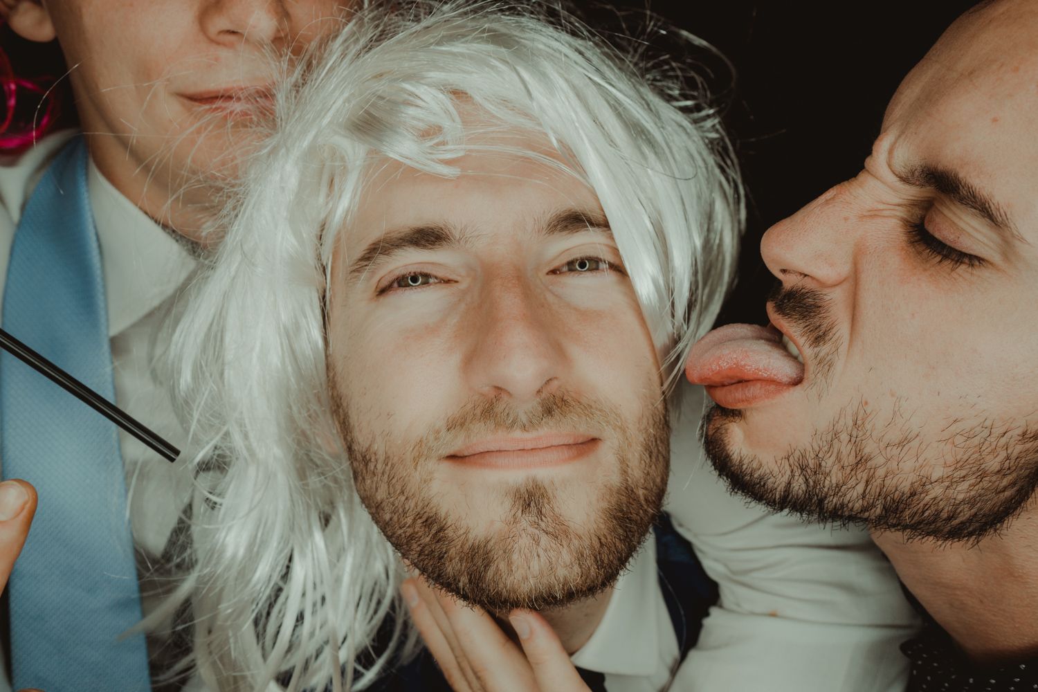 Candid photo booth moment captured by Portugal wedding photographer
