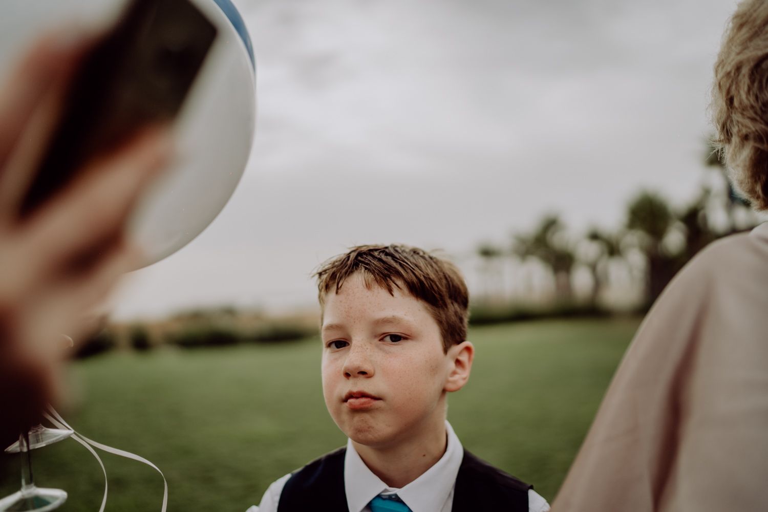 Algarve wedding photographer capturing an emotional cake cutting scene at beachside venue