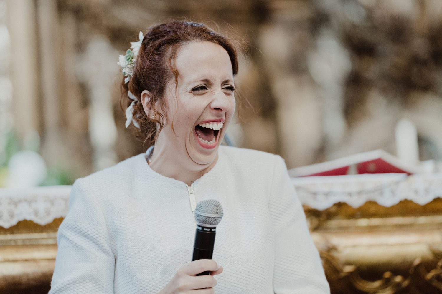 Bride laughing while speaking during an intimate wedding in Porto