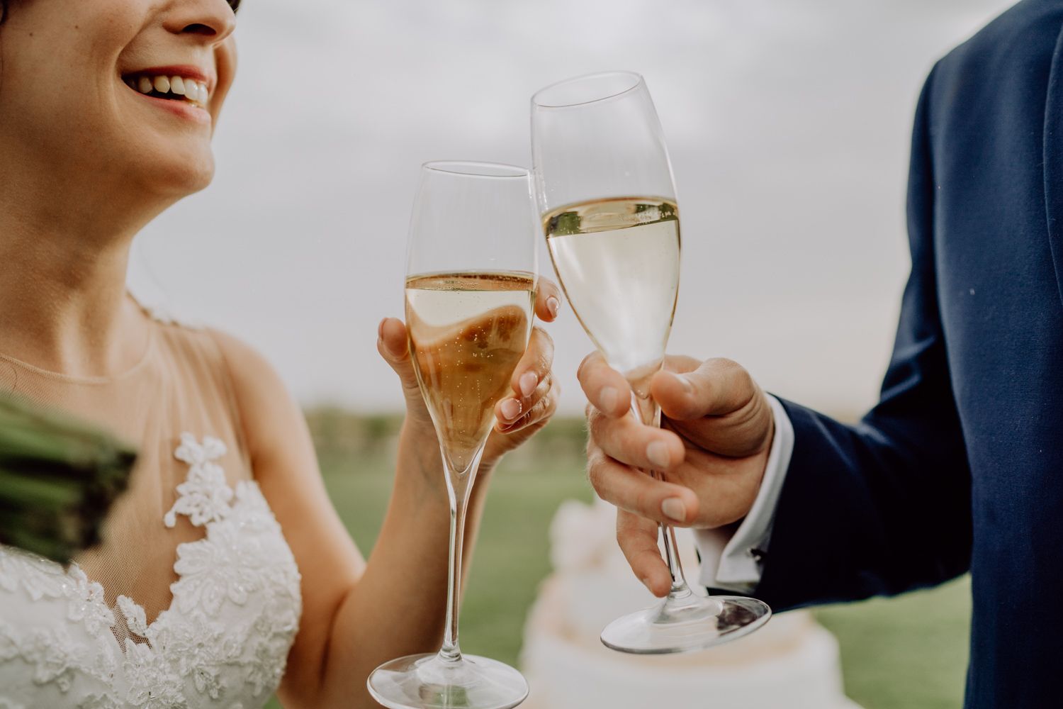 Algarve wedding photographer capturing an emotional cake cutting scene at beachside venue